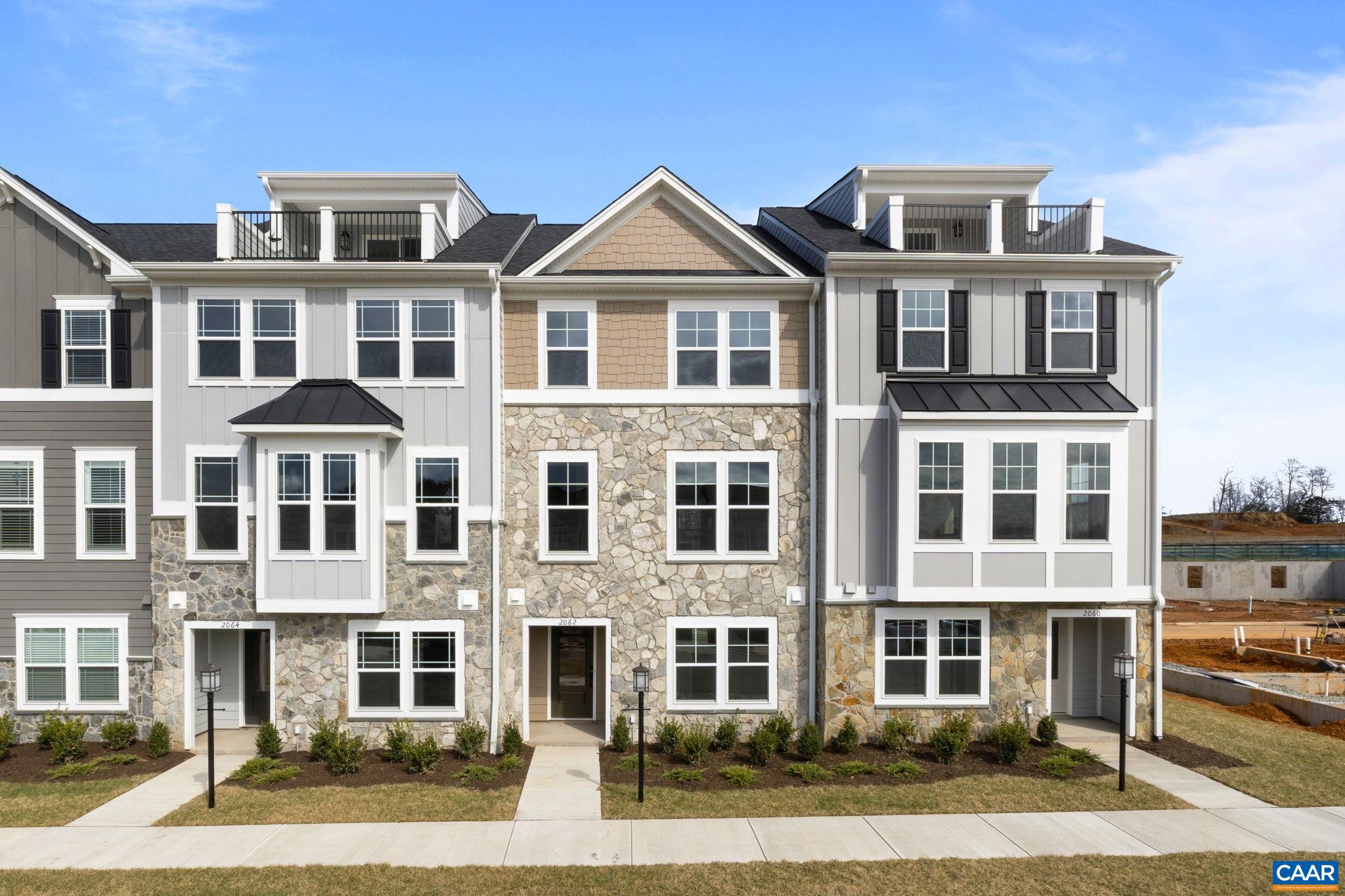 Currently under construction for a late summer 2025 move-in, the Poplar II townhome in Glenbrook offers three finished levels of well-planned living space. The entry level features an attached two-car garage, a versatile rec room, and a convenient half bath. On the main level, you'll find an open layout with a spacious family room, kitchen, dining area, walk-in pantry, and another half bath—plus access to the rear deck, great for enjoying fresh air just off the dining space. Upstairs, the layout includes a primary suite with a private bath and large walk-in closet, two additional bedrooms, a full hall bath, and laundry conveniently located in the hallway. Set near walking trails with future direct access to downtown Crozet and just a short distance from parks and mountain views. Photos shown are of a similar home and may include optional or upgraded features.