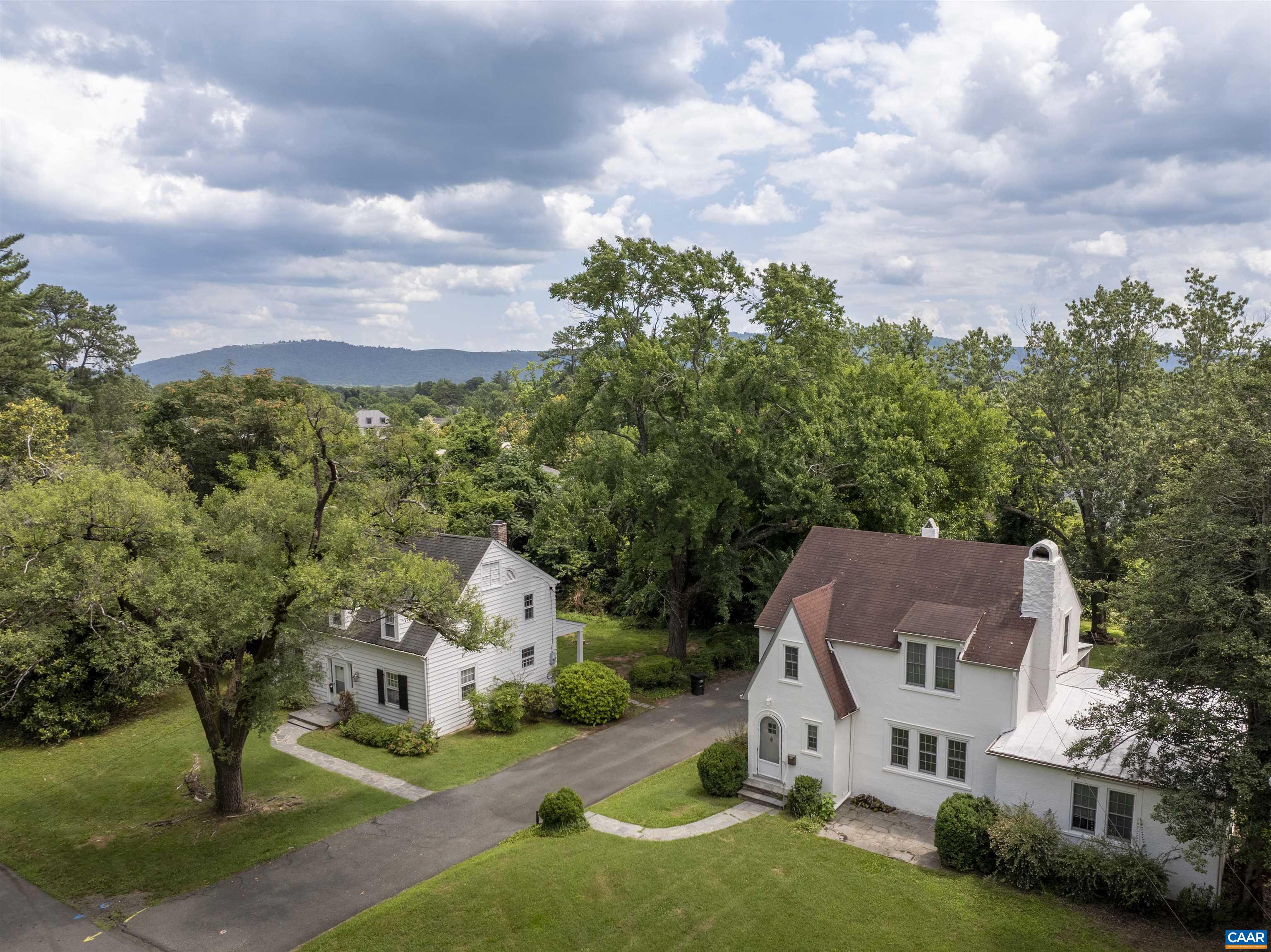 Unique opportunity to purchase TWO houses on Stadium Road. Both parcels combined total .71 acres in a prime UVA-adjacent location, right across the street from Runk Dining Hall. Each house is character-rich with many original details preserved, including hardwood floors, craftsman-trim, original glass doorknobs, plaster walls, built-ins (2203), gas fireplace with brick surround (2201), an incredible stone fireplace (2203), generously-sized spaces, and dedicated dining rooms. Large, level lot is a rare find in Charlottesville. 2201 is 3 bedrooms, 1.5 bathrooms. 2203 is 3 bedrooms, 2 full bathrooms with an attached, separately metered apartment that is 1 bedroom, 1 full bathroom (no kitchen). These houses are GEMS, with some updates they could be fantastic single-family homes or upscale rentals. OR, consider the future possibilities of increasing density in a prime UVA location.