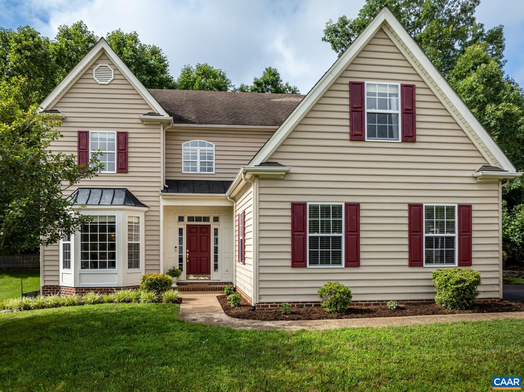 This lovely colonial is nestled in Crozet's desirable Grayrock neighborhood.  It boasts five bedrooms, three and half baths and mountain views.  On the main level, you will find the foyer, dining room, kitchen, breakfast nook, laundry room, half bath, one of the primary bedrooms, and a large great room with vaulted ceilings and a gas fireplace.  The second level offers the second primary bedroom and 3 additional bedrooms.  One of the bedrooms is currently being used as a playroom/office. This home has tons of built-ins and lots of closet space.  There is a charming backyard with a patio, pretty landscaping, and a newly installed wooden fence.  Grayrock has two ponds and two playgrounds to enjoy.  Downtown Crozet, vineyards, orchards, trails, and I-64 are within close proximity.    Open Houses will be held on Saturday and Sunday from 1 to 3.