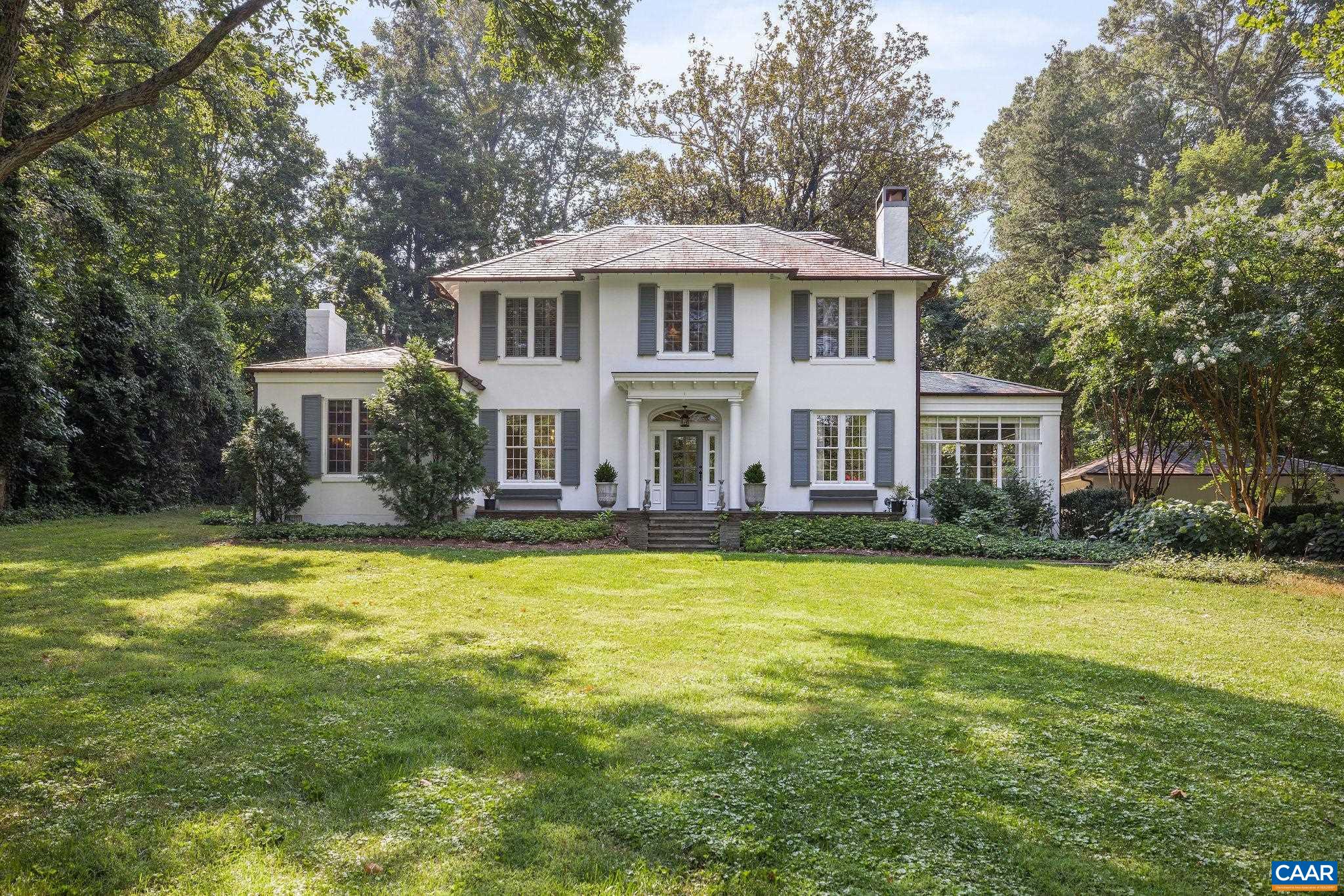 Introducing Magnolia Hill, a timeless home set back off one of Charlottesville’s most sought-after streets in the heart of the Barracks/Rugby neighborhood. This classic property has been thoughtfully updated to offer modern comfort while preserving its original character. The kitchen features custom cabinetry, a large center island, and top-tier appliances, connecting easily to multiple living and dining areas. Main and second-floor primary suites provide flexibility for everyday living or hosting guests. A detached guest cottage includes a bedroom, full kitchen, bath, and dedicated home office—perfect for visitors or working remotely. Outdoor living is just as inviting, with bluestone patios, a saltwater endless pool, fire pit, sport court, and dining area, all surrounded by mature landscaping. Just minutes from UVA and downtown, in one of the city's most established and desirable neighborhoods.