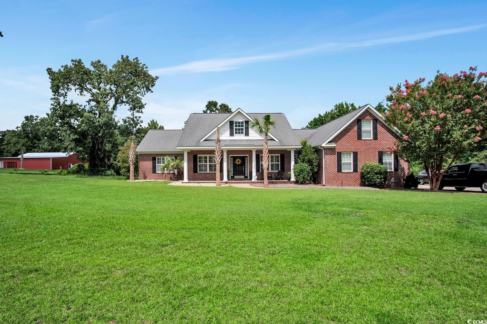 Charming All-Brick Country Home with Modern Amenities!!!  Welcome to your new country retreat!   Situated in the tranquil outskirts between Loris and Conway,  this stunning all-brick home, nestled on a spacious 1.22-acre lot, seamlessly blends classic charm with contemporary comfort. Boasting 3 bedrooms, all with walk-in closet, and 2.5 bathrooms, all on the first level.  There is a versatile second floor bonus room that could be used as a fourth bedroom.  This residence offers ample space for relaxation and entertainment with its open concept.  The home has been freshly painted and professionally landscaped.  As you enter, you're greeted by the elegance of hardwood floors flowing through the living and dining areas.  The kitchen, baths, and laundry room feature stylish tile flooring.   The  Master Suite provides a luxurious escape with tray ceilings, two walk-in closets, and a spa-like master bath complete with a jetted garden tub, separate walk-in shower, and double vanity sinks.  Two additional bedrooms are thoughtfully designed with a Jack and Jill bathroom, ensuring privacy and convenience. The bonus room, measuring 12 x 23, offers a flexible space perfect for a home theater, playroom, or guest suite.  Completing the main level is an office / study area, formal dining room, living room and a kitchen that features sleek solid countertops, stainless steel appliances, and ample storage.  Enjoy the outdoors from the screened porch that opens to a wood patio deck, ideal for relaxing or hosting gatherings. The property includes a detached all-brick insulated garage/workshop, offering a dedicated space for hobbies or additional storage in its attic, complete with a winch system to lift those heavier things into it.  The property features a well irrigation system for all your outdoor watering, The home is equipped with an alarm system and fiber internet is available. With public water and a private septic system, you'll enjoy both reliability and independence.  Located with easy access to Hwy 22, Conway, and just 30 minutes from the beaches, this home provides the perfect balance of peaceful country living and convenient proximity to local amenities. Plus, there’s no HOA, giving you the freedom to make this house truly your own.