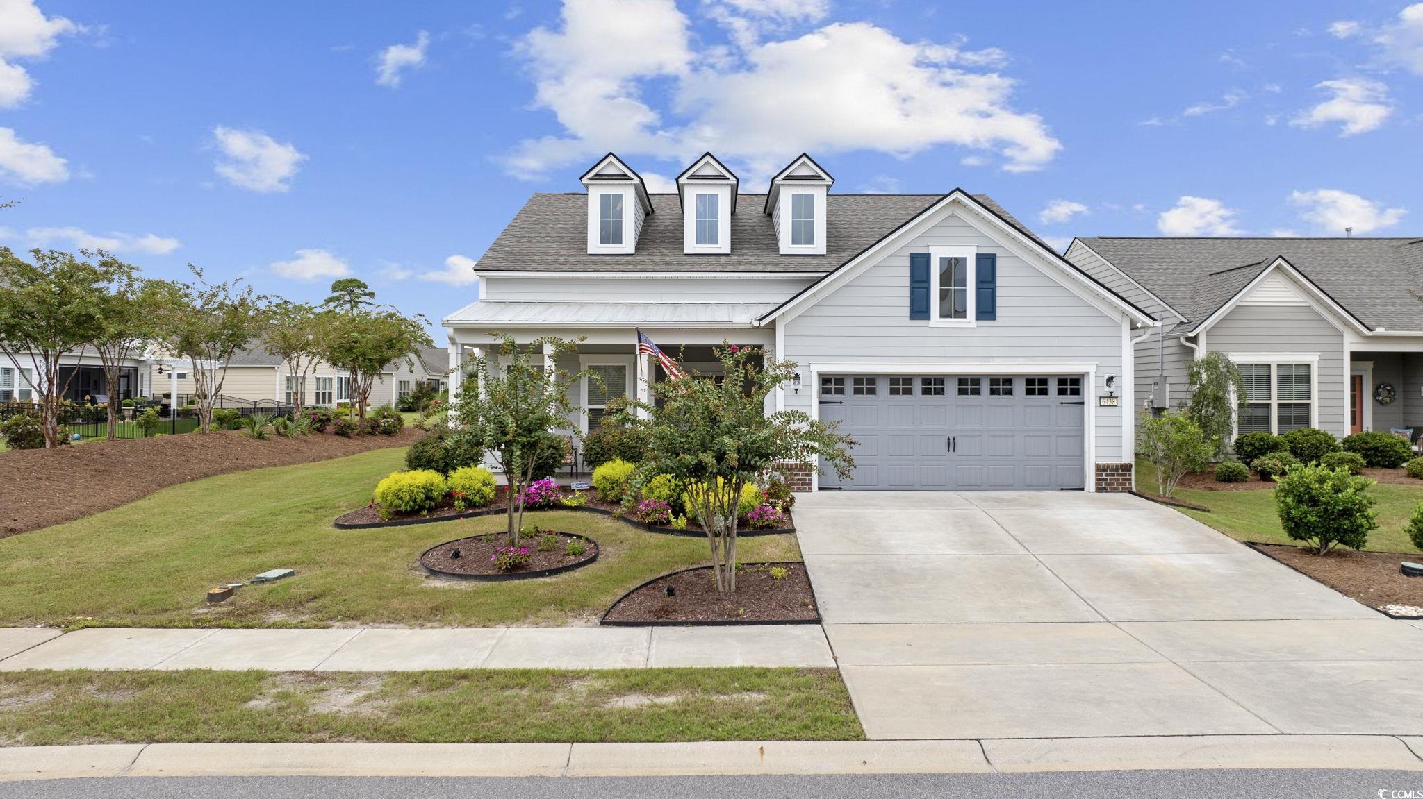 This stunning property is situated in the prestigious 55+ Del Webb community at Grande Dunes, offering a blend of luxury and convenience in single-story living. The Martin Ray floor plan boasts a gourmet chef's kitchen, a spacious dining area, and a welcoming gathering room. A versatile flex room can serve as a den, office, or library—currently used as an office by the owner. The master suite features a large custom walk-in closet, a spacious walk-in shower, and a double vanity with ample storage. Additional highlights include a Butler’s Pantry along with pull out drawers in the kitchen cabinets, granite countertops, an elegant arched foyer, hurricane-rated storm doors, and extensive storage. Relax in the heated and cooled Carolina Room, equipped with electric blinds, or enjoy the serene pond views from the patio, complete with an outdoor kitchen, pavers, and an electric awning. The home also features a full home central vacuum system that was just installed last year, custom hurricane shutters, ceramic tile in the bathrooms and laundry room, and hardwood floors throughout the rest of the living areas. The garage, front porch, patio, and Carolina Room are all finished with durable polyaspartic coating, and the garage itself is both heated and cooled with overhead storage. A pull-down attic staircase provides access to even more storage space. As a resident of Grande Dunes, you'll have access to an array of top-notch amenities, including monthly activities at the Amenity Center, indoor and outdoor pools, a relaxing spa, and sports courts for bocce, pickleball, and tennis. Enjoy leisurely walks or bike rides along the community’s scenic paths, and with the convenience of golf-cart-friendly streets, running errands or heading to the beach has never been easier. Your HOA dues also include access to the exclusive Grande Dunes Beach Club, completing the ultimate beach lifestyle.
