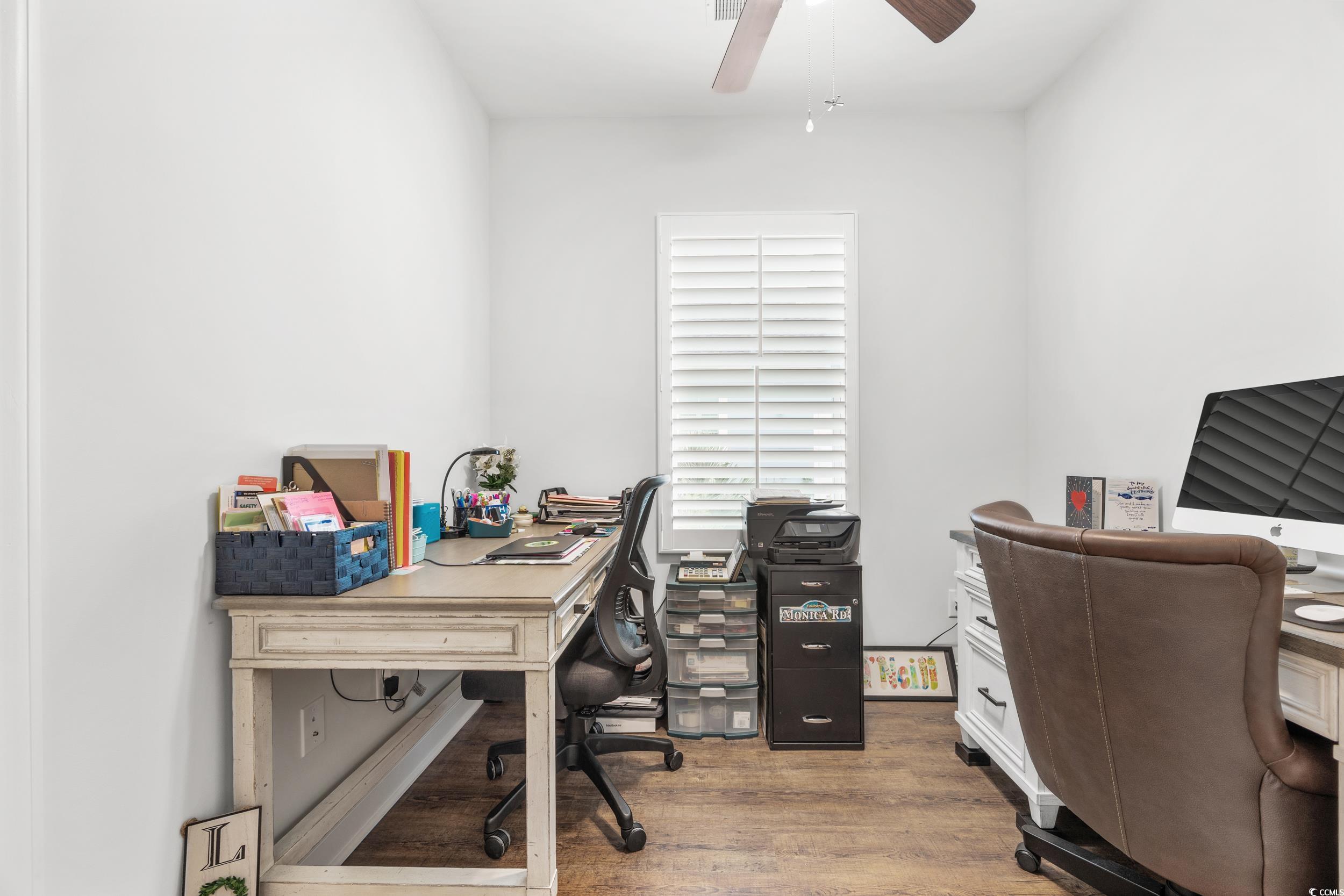 Office featuring wood-type flooring and ceiling fan