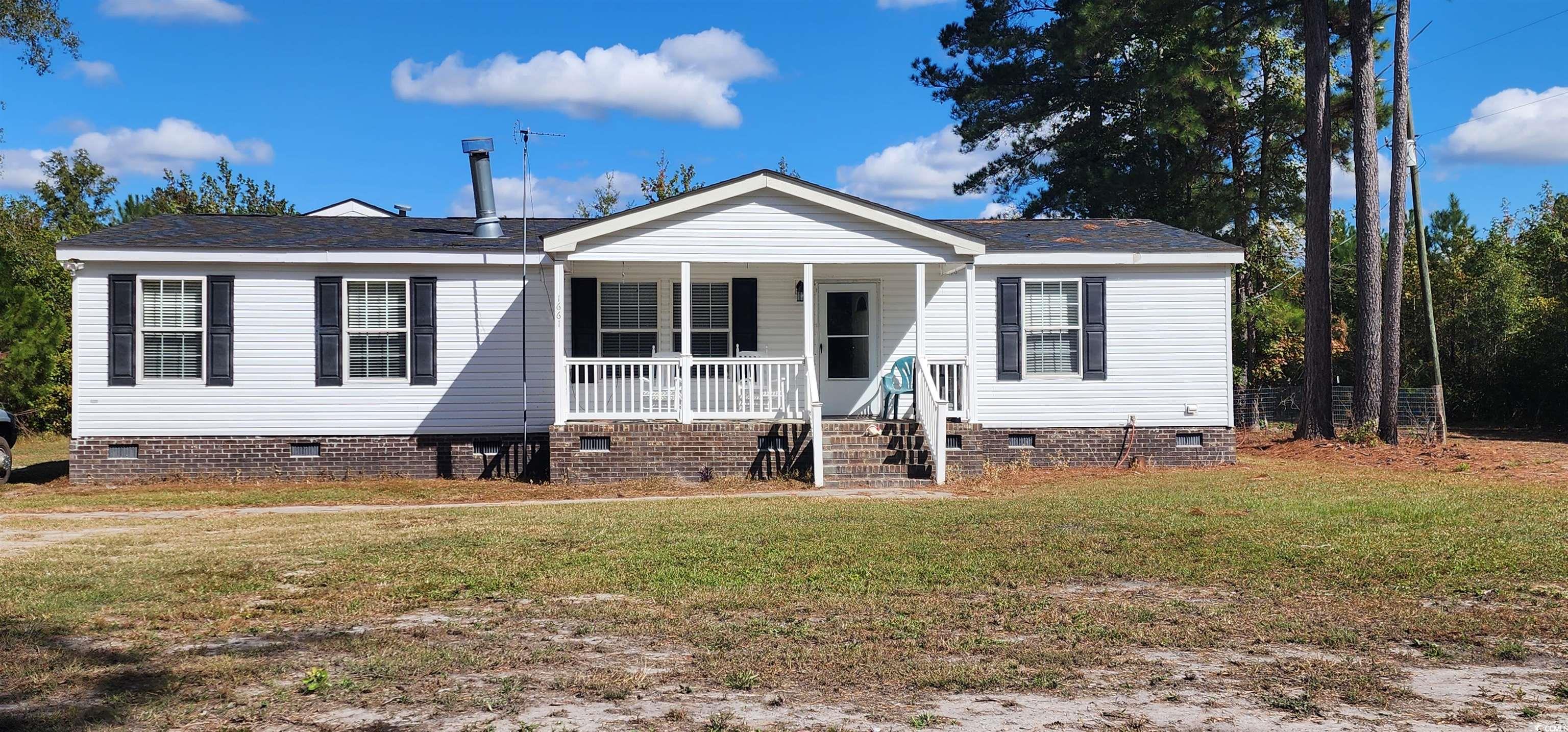 Seller open to view all offers. Check out this 3br 2ba on 6.13 acres of country living where you can sit on your back screened in porch to watch the deer and turkey that visit. Cozy up to the fireplace on those cold nights. The home has a fenced in back yard for your fur babies and most of the property has fencing. The entry has a beautiful black heavy duty gate with a deer design cut out. There is also a large gate on the back side of the property wide enough for your farm equipment to go through.  The home is in the process of being renovated.  It has a double car garage for your vehicles or other items you want to keep out the weather. New roof installed in 2024. The owner is putting down vinyl plank flooring and painting. The property line has been cut out big enough for your 4-wheelers. You will be just minutes to I-95 and to Lake Marion.  Come make this your dream home today.