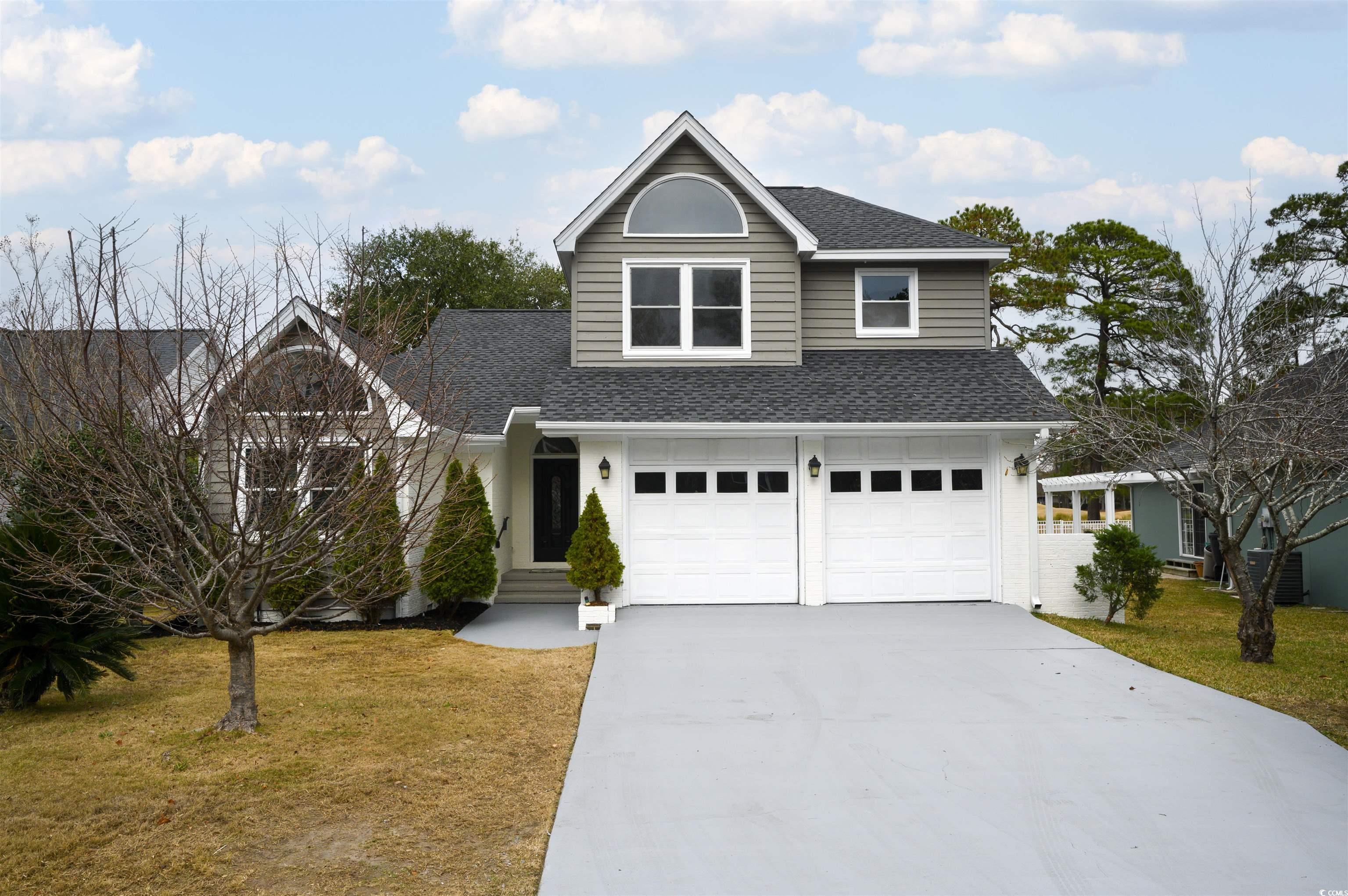 Welcome to the prestigious sought after Prestwick community.  This two-story traditional home offers an open concept with a master on the 1st floor!  As you enter the foyer area you are welcomed with lots of light, vaulted ceilings and a fireplace.  From there , the Carolina room offers a spectacular view of the 11th and 12th fairways!  The open concept kitchen is adorned with; 42 " cabinetry, new granite and subway tile back splash!  Upstairs is perfect for children or guest with an open loft area, two bedrooms, full bath and two floored storage areas.  The outdoors has a 25' x 10' deck , with a retractable remote awning, perfect for entertaining in all seasons!  Roof was replaced in 2022 along with a new HVAC unit in December 2024, exterior has been freshly painted.  Interior features new; flooring, paint, light fixtures and granite countertops. Master bath includes updated tiled shower, free standing tub and what a beautiful view of the golf course! Don't miss this opportunity to live in a premier, guarded gate community in an excellent location. Prestwick offers a Pete Dye designed golf course, pool with shaded cabana areas, tennis courts and the beach is only a mile away as well as close proximity to many activities this area has to offer! Also, a short golf cart ride away from The Market Common! Buyer must verify square footage.  Agent is the owner of this home. This home is ready for YOU!