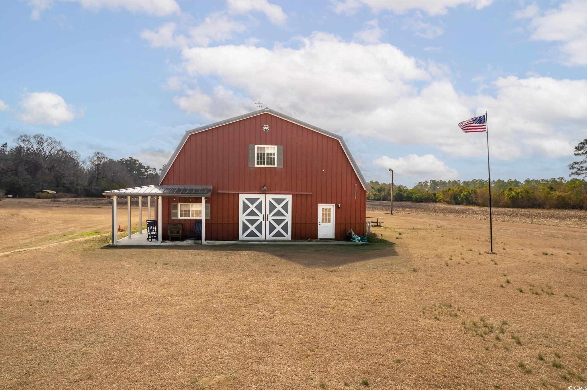 This unique property sits on 18.74 acres of picturesque land, featuring a spacious barn with versatile potential. This Morton barn was built on a 79x42 concrete slab. As you enter the property down the long driveway, you are met with welcoming charm. You enter the barn through the kitchen, where you are greeted with ample counter space, a large pantry, double ovens and southern charm! Access the second level through the stairs in the kitchen or enter into the workspace through the door! When walking into the work room, you will notice two barn doors that slide open, three horse stalls and three garage bays. There is also a storage room and full bathroom on the bottom level for any guests that you have over! When you walk upstairs, you enter the vast living space. The bedrooms are located on either end, and both have large closets attached. You have a full bathroom and laundry room off of the living space. The property has previously been used for both residential and commercial use, making it a perfect choice for those seeking a blend of rural charm and entrepreneurial opportunity. Whether you’re looking for a peaceful retreat or a place to run a business, this property offers the flexibility to suit your needs.