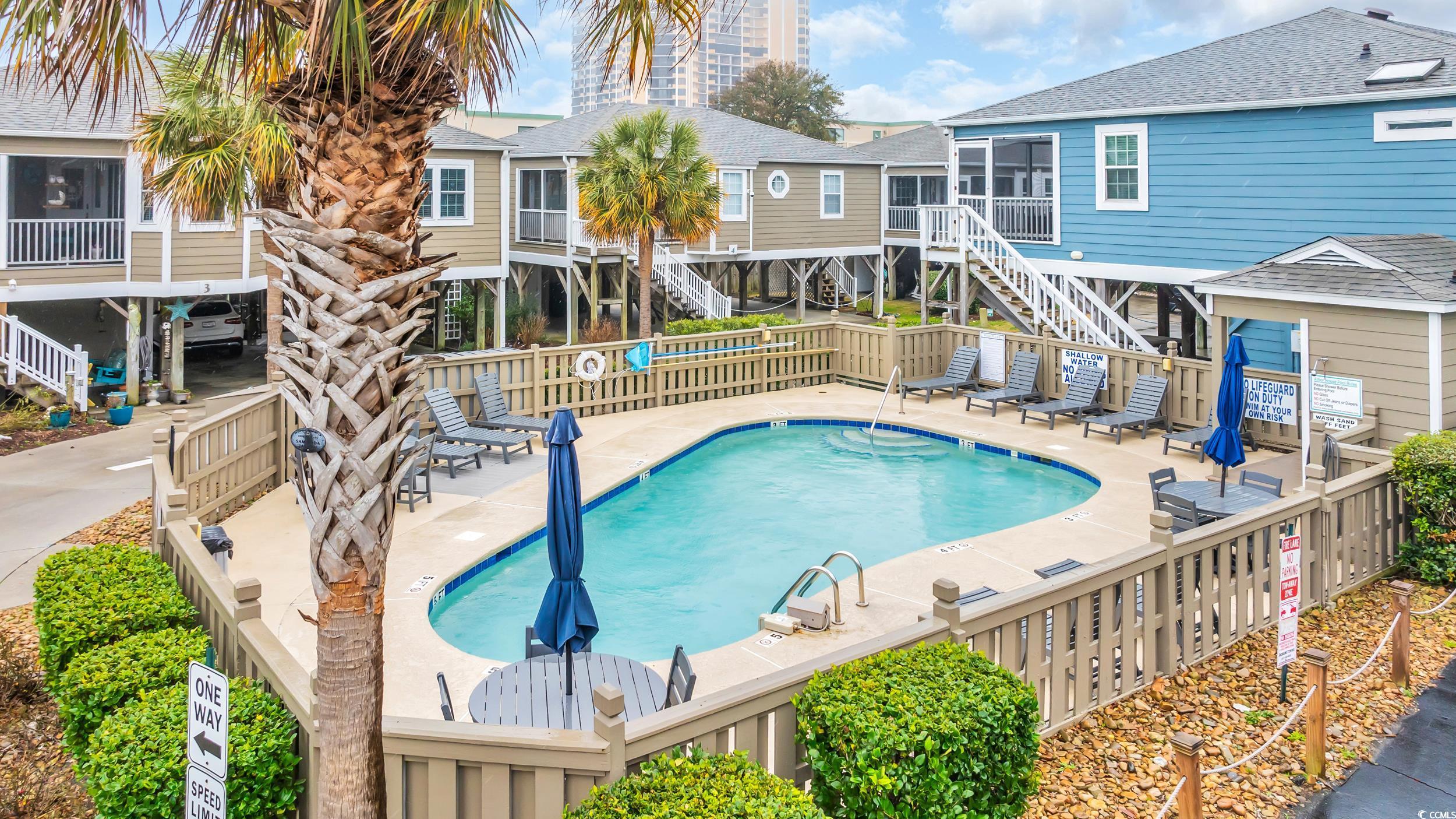 View of swimming pool with a patio area