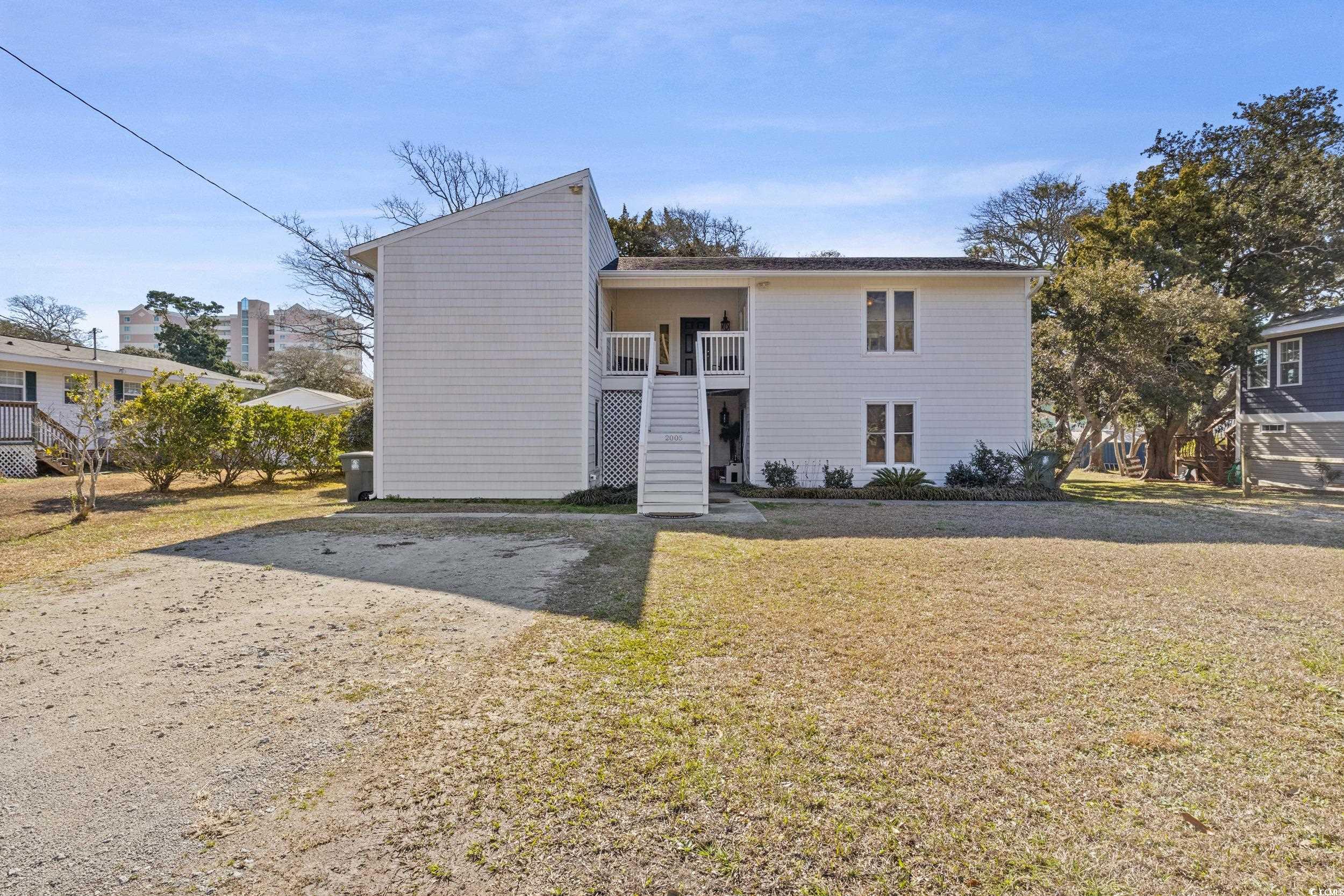 What an opportunity for your investment, second home, or primary home just two blocks from the beach.  Upstairs unit has a great deck overlooking the fenced backyard. Downstairs has a beautiful patio perfect for cookouts or family gatherings. A shed does convey on the property.  All this is only two blocks from the beach!!