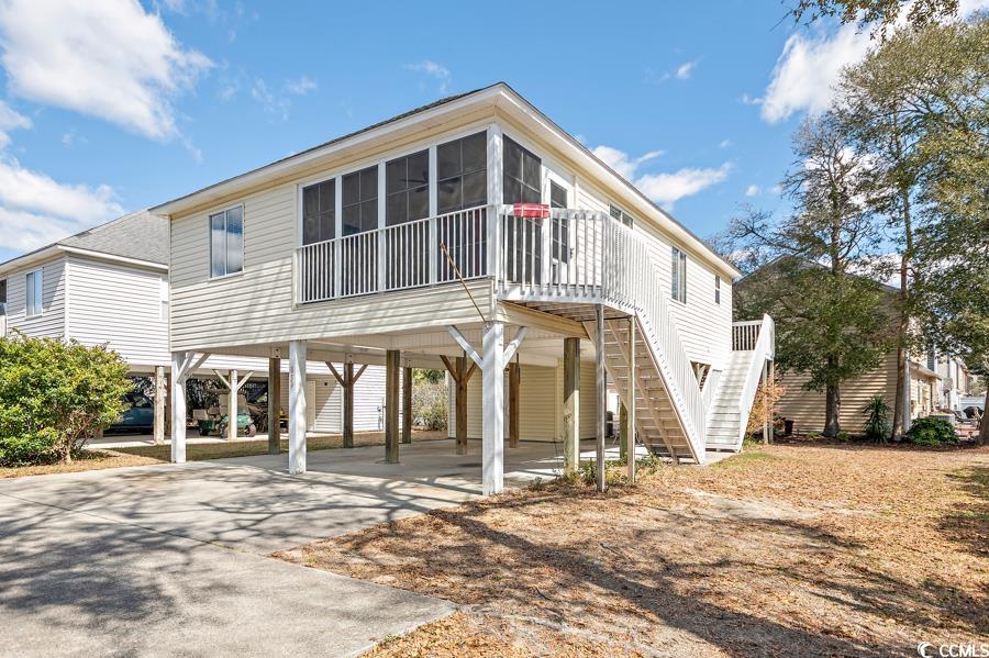 Come see this amazing beach house! Great primary, 2nd home, or investment opportunity. No HOA! Great location nestled off 9th Ave S in quiet area. The home features 3 bedrooms and 2 bathrooms. The house has a large open dining/living area. Granite countertops, LVP flooring, primary bedroom, the front porch has vertical sliders and can be conditioned or raise the sliders and it is a screened porch. Great size lot for a pool addition or design your outside oasis. Walking distance to the beach and short distance to restaurants, groceries, and entertainment!
