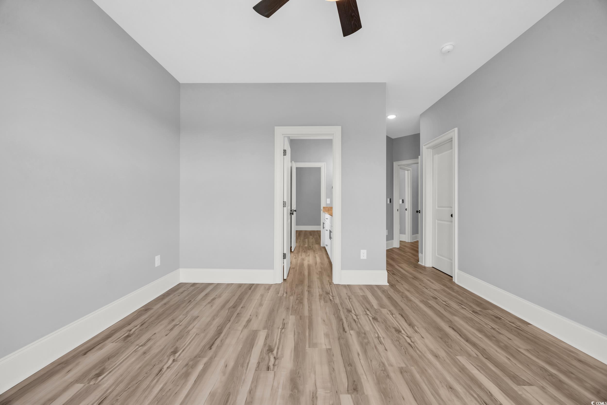 Unfurnished bedroom with light wood finished floors, baseboards, recessed lighting, and ceiling fan