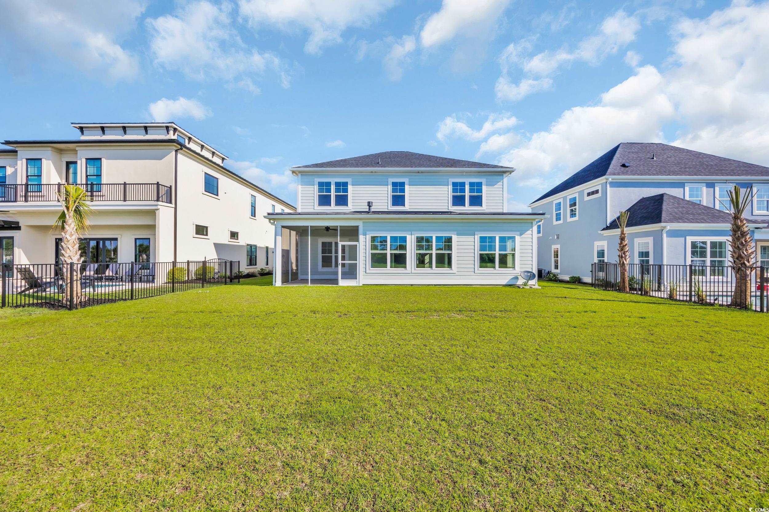 Back of house featuring a sunroom