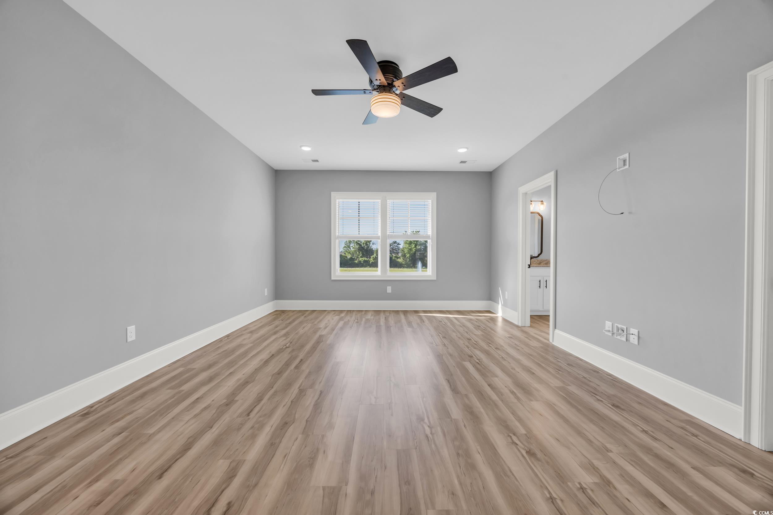 Unfurnished room with a ceiling fan, light wood-style flooring, baseboards, and recessed lighting