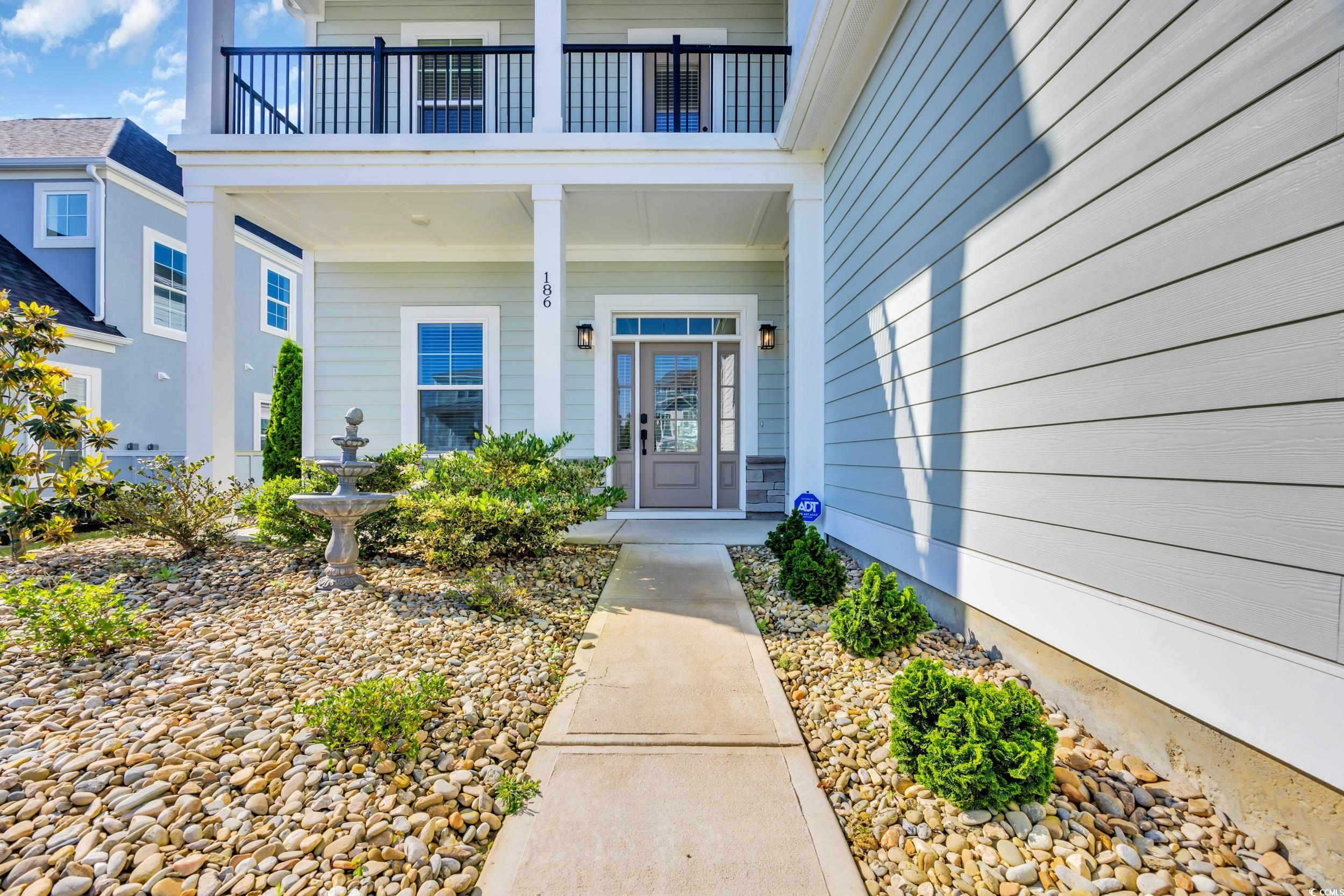 Doorway to property featuring a balcony