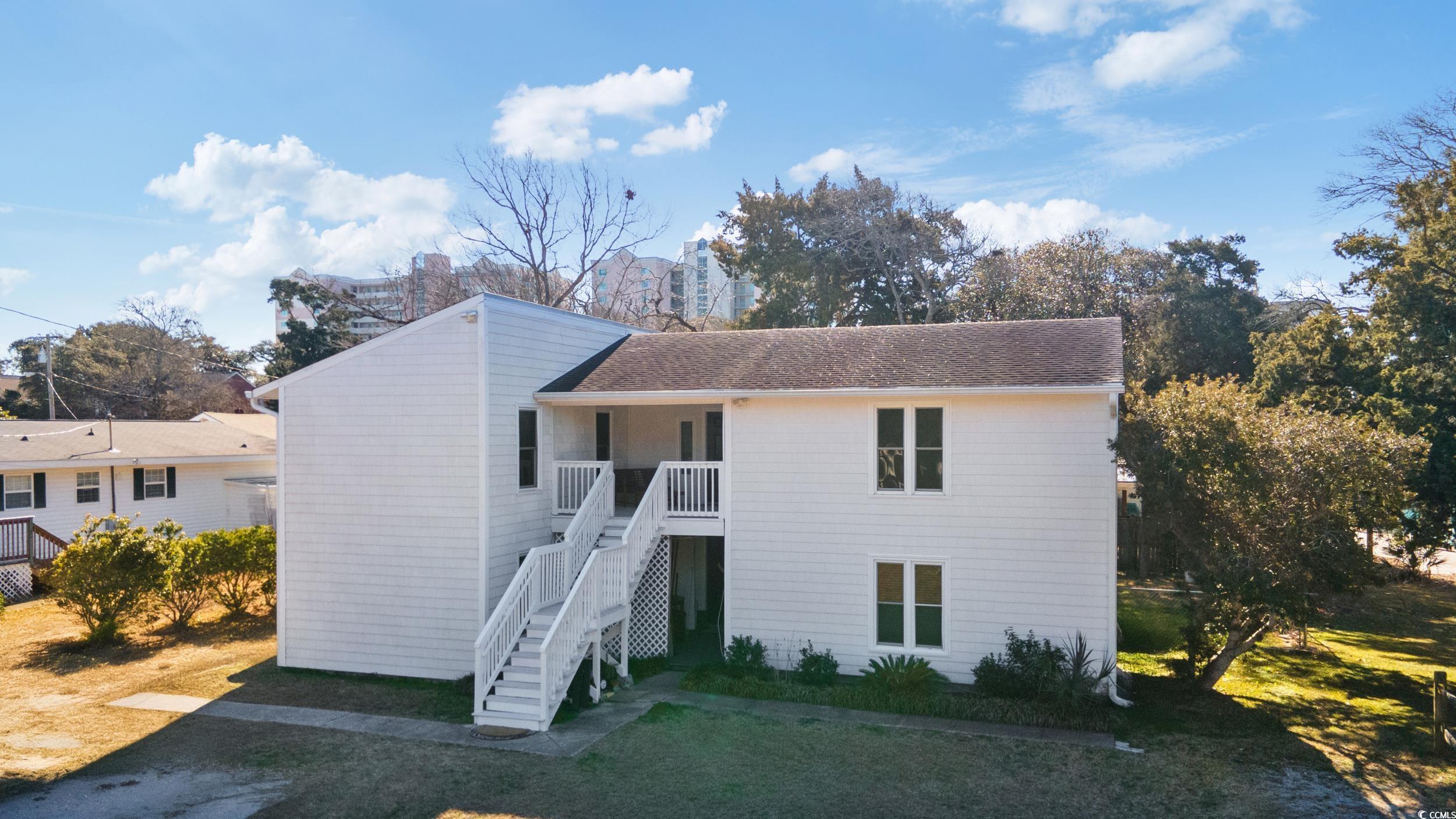 Adjusted Price Just for you! What an opportunity for your investment, second home, or primary home just two blocks from the beach. Upstairs unit has a great deck overlooking the fenced backyard. Downstairs has a beautiful patio perfect for cookouts or family gatherings. A shed does convey on the property. All this is only two blocks from the beach!! Both units offer 3 bedrooms and 2 full bathrooms.