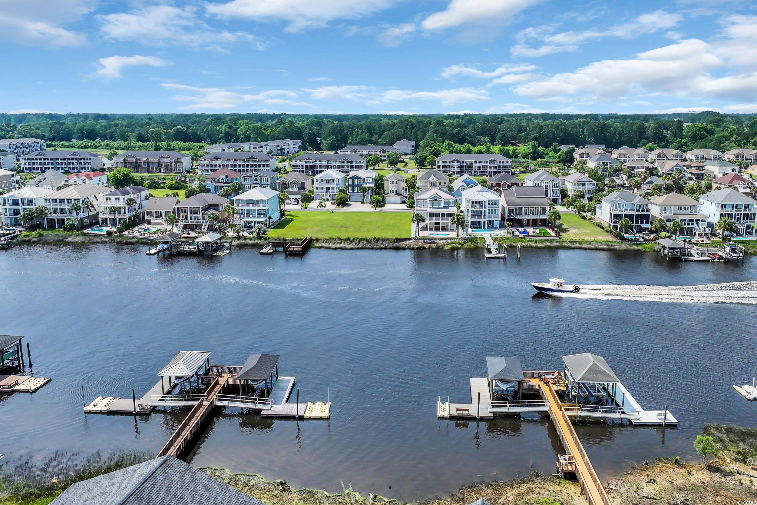 Aerial perspective of suburban area with a large body of water