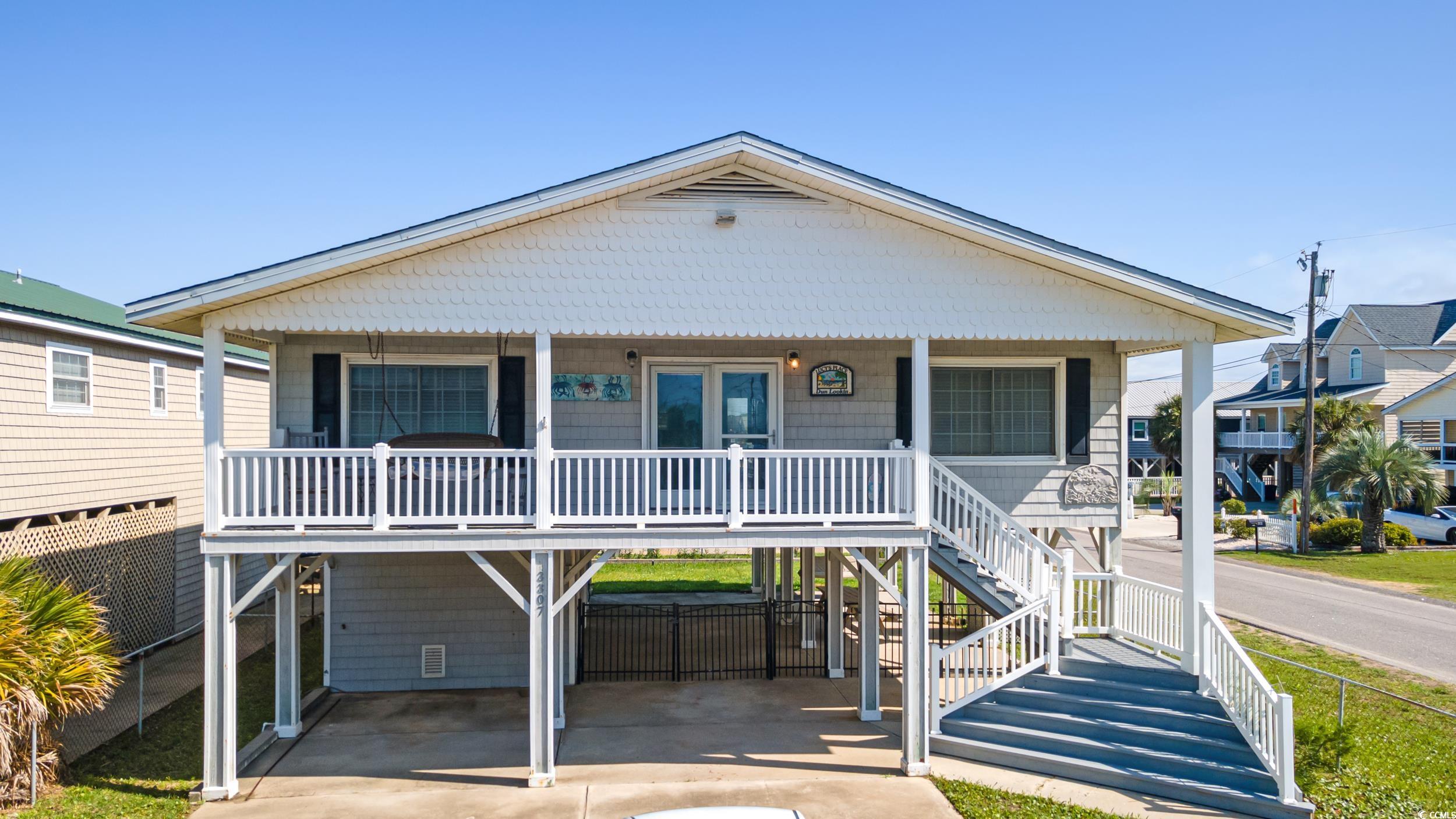 Don’t miss your chance to own an amazing 4-bedroom, 2-bath coastal retreat just ONE BLOCK from the beach in sought-after Cherry Grove, SC! This beautifully maintained home offers canal views and is being sold completely furnished, ready for you to move in or rent out.  Never rented by the current owners, this home has served only as a serene second residence. Whether you’re looking for a permanent beachside haven, a lucrative investment property, or a relaxing vacation escape, this home is the perfect fit. With Ocean views from the front porch, this offers all the benefits of laid-back life. A fenced in yard with grass is a perfect place for your pets.   ?? Prime Location: Just steps to the sand and ocean ?? 4 Bedrooms | 2 Full Bathrooms ?? Canal views & coastal breezes ?? Sold fully furnished – move-in ready ?? Easy to show – schedule your private tour today!  Don’t let this rare gem slip away. Call now to arrange your showing and start living the beach life you’ve always dreamed of!