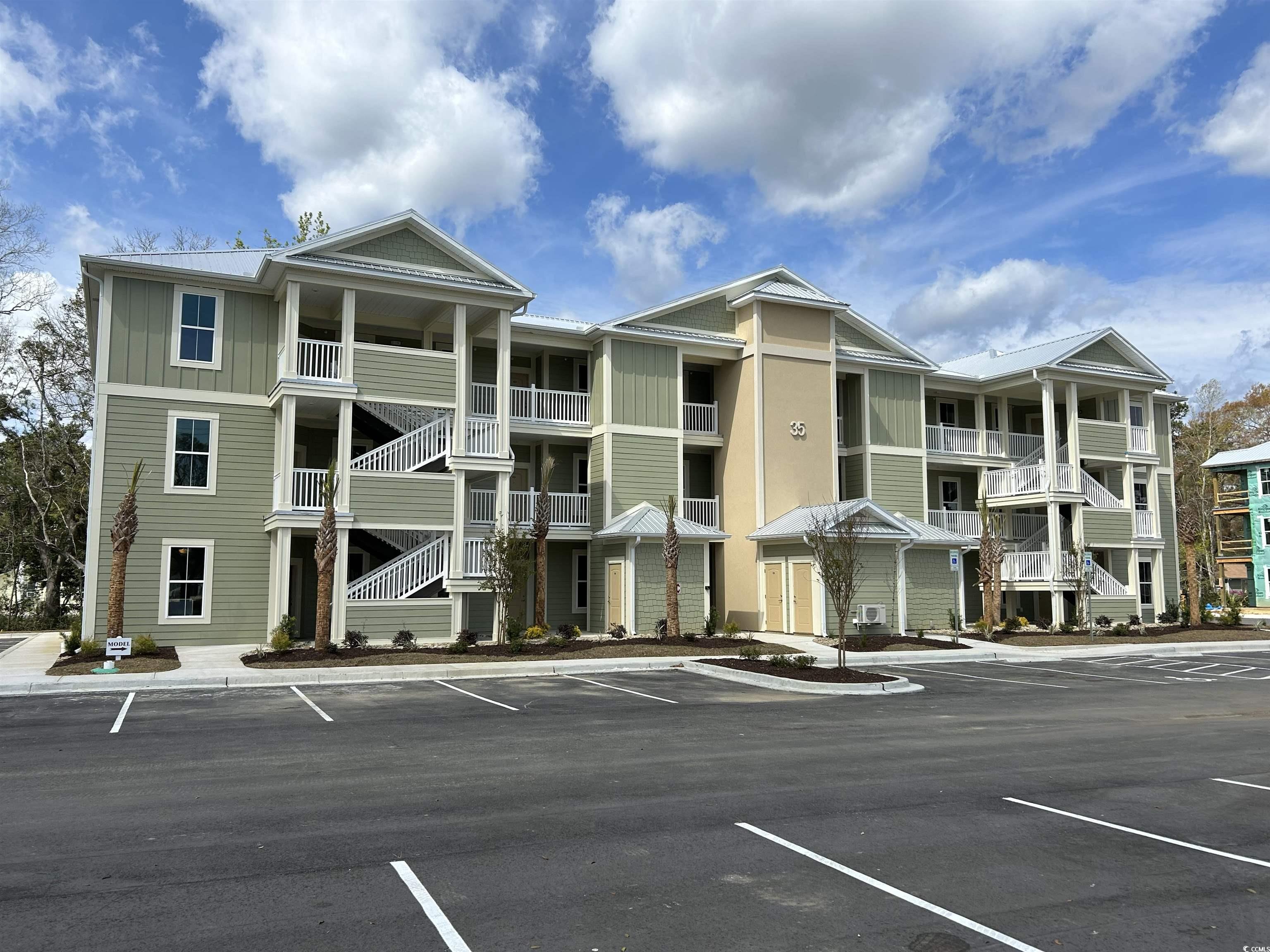 this condo community is located in the heart of the south carolina coast in a charming, historic fishing village. enjoy boating, live music, restaurants and scenic marsh views. it is located just 20 miles south of myrtle beach.  the condos boast hardwood floors in the living areas, granite countertops in the kitchen and much more. each building has it's own elevator. enjoy the community pool and clubhouse. (interior photos are from a previously built condo project. specifications and colors may vary.) square footage is approximate; the buyer and buyer's agent are responsible for verifying all square footage and all other information. square footage came from the builder's floor plans and survey. seller/builder reserves the right and may change these floor plans, specifications, and dimensions without prior notice.