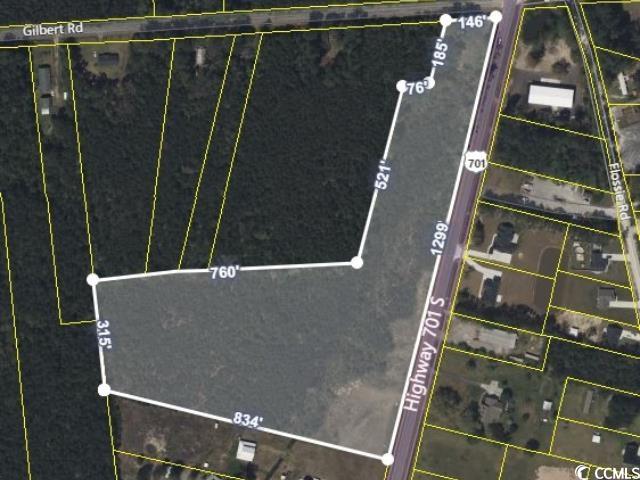 12.34 commercial land off the corner of highway 701 and gilbert road.  water and sewer available.