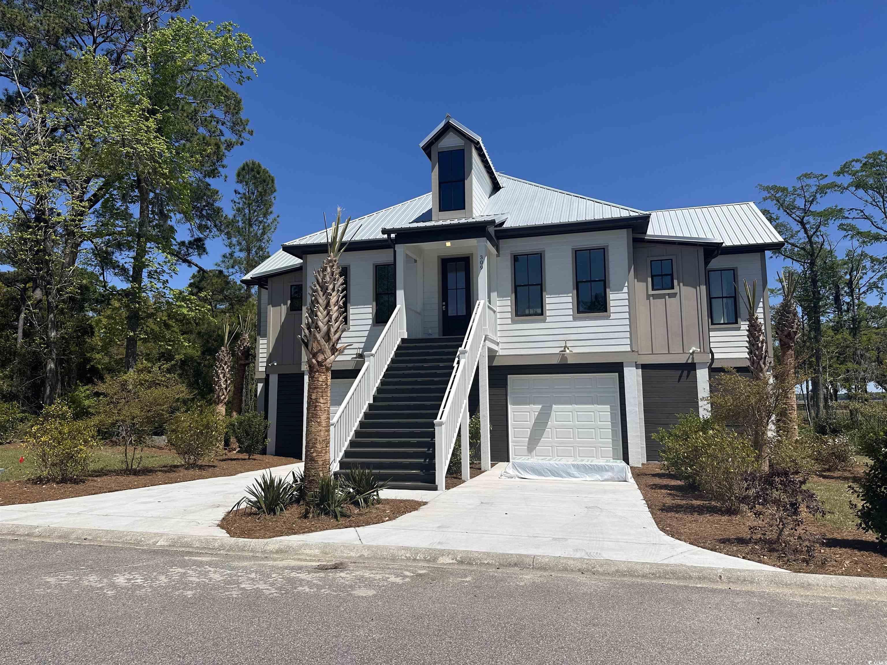 nearly complete and ready to occupy!  great views of winyah bay and the intracoastal waterway in georgetown, sc.  you can have it all.  this is a 3 bedroom, 3.5 bath home with great open floor plan.  the living room will have cathedral ceilings and a porch with amazing views of winyah bay!  this home will be constructed to withstand even the strongest storms.  metal roof.  the kitchen will have white shaker soft-close cabinets, single bowl farmhouse sink, carrara quartz countertops and fridgidaire gallery gas appliance package.  other features include tankless hot water heater, tile showers and lots of parking under the house.  south island plantation is a gated community full of live oaks on winyah bay at the southern end of georgetown.  it is less than 60 miles to historic charleston, sc and 40 miles to myrtle beach.  just a few miles to georgetown's front street with boutique shopping and dining.  this community has a beautiful clubhouse with a fitness center, an outdoor pool and outdoor walking and biking trails!