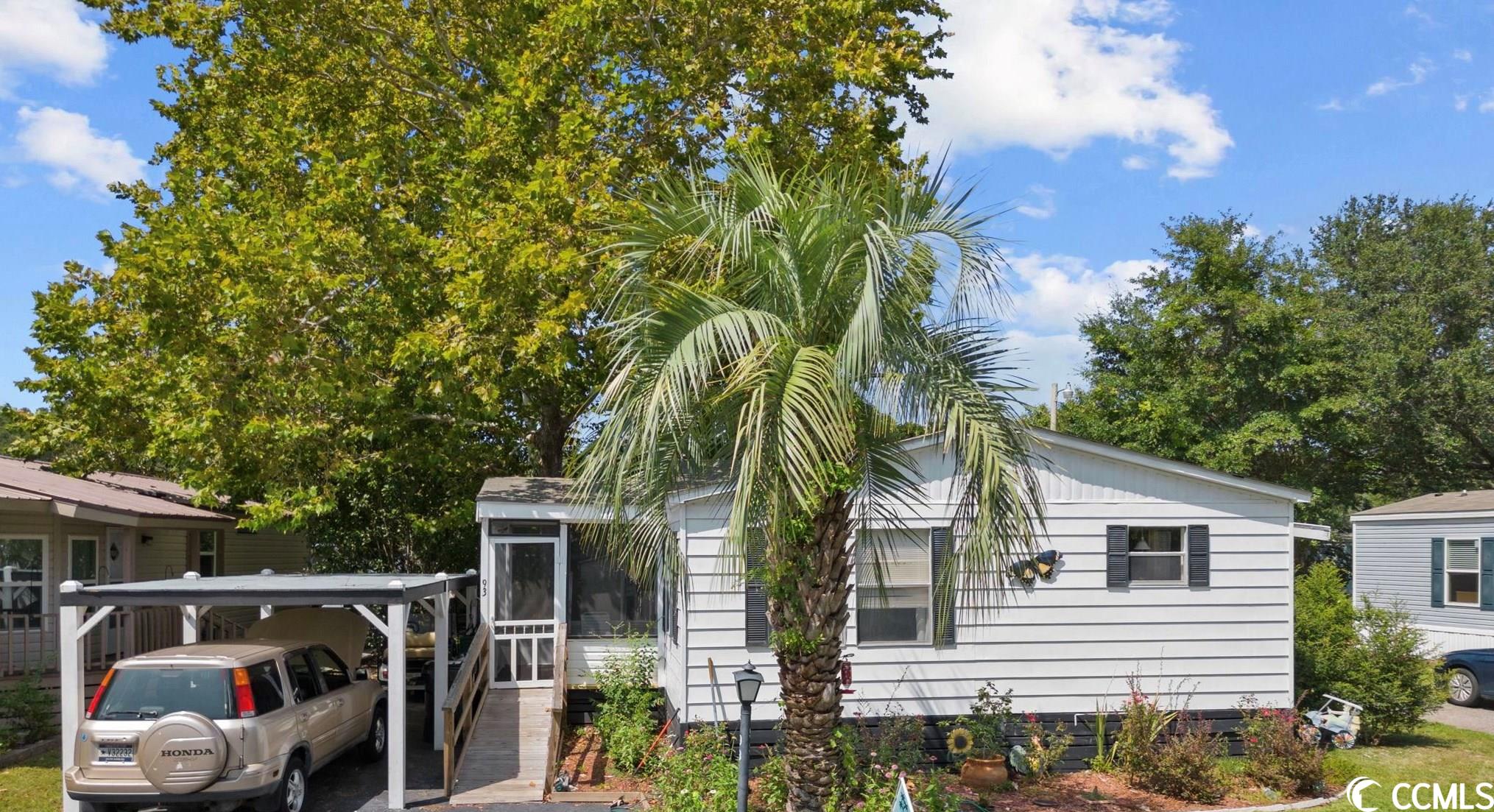 newly refurbished 3 bedroom, 2 bathroom double wide manufactured home in inlet oaks village: a vibrant 55 and older community offering a clubhouse and pool exclusively for residents and their guests. this charming residence is ideally situated near waccamaw hospital, brookgreen gardens, and the renowned murrells inlet marshwalk.  the property boasts an array of features, including a convenient carport, two inviting screened-in porches, a spacious master bedroom, a wheelchair ramp, and a modernized kitchen. positioned to face the serene pond, residents can relish picturesque sunrises each morning, creating an idyllic living environment. seller financing is available. home sold furnished.