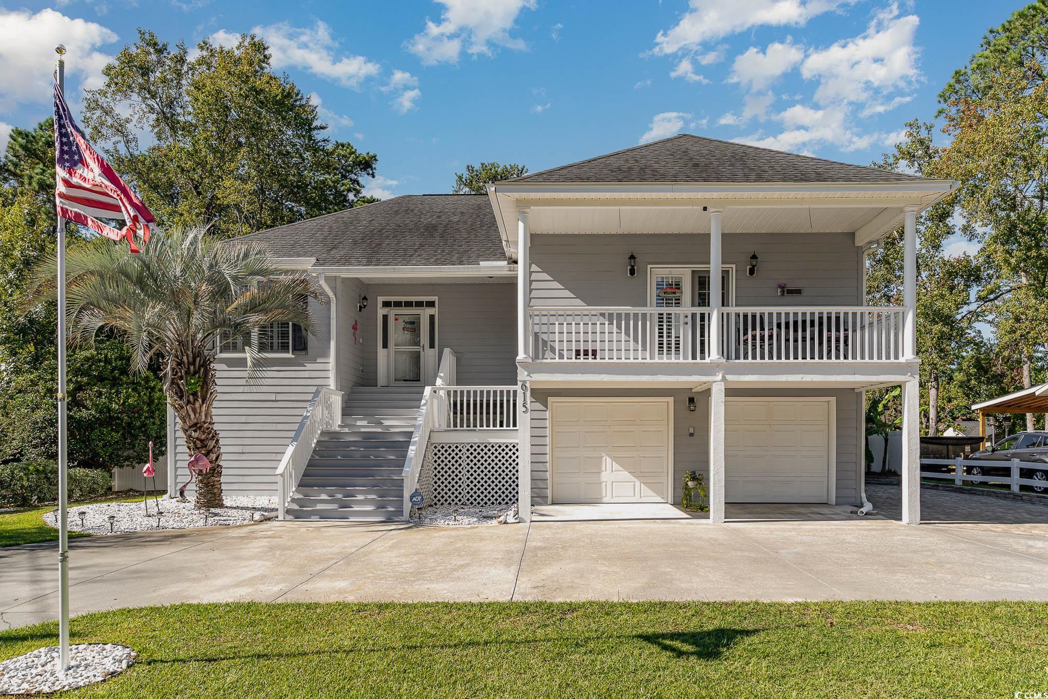 reduced!! surfside beach welcomes you to this beautiful home, this delightful home offers a unique coastal lifestyle just a short golf cart ride away from the beach. property features a dock w/ retaining wall overlooking rodgers lake in back that is surrounded by private residences with no public access. the pond has never flooded and the home is not in a flood zone. the pond has fish for recreational pleasure. this home is located in a "no short term rental" location of surfside beach which keeps it quiet and stable. house is immaculate, tile in all living areas, plenty of parking under house and circular driveway, sea wall, corian counter tops, 9' ceilings, vaulted great room ceiling and tray ceiling in master bedroom. this home has 3 bedrooms and two full baths on the main level and an amazing guest suite with 2 bedrooms with one full bath on ground level w/ private exterior entrance, plus extra storage room or workshop, only 3 blocks to beach. additional amenities such as an outdoor shower for rinsing off sandy feet, a storage area for beach gear, and a garage for a golf cart. no hoa!!  not in a flood zone!