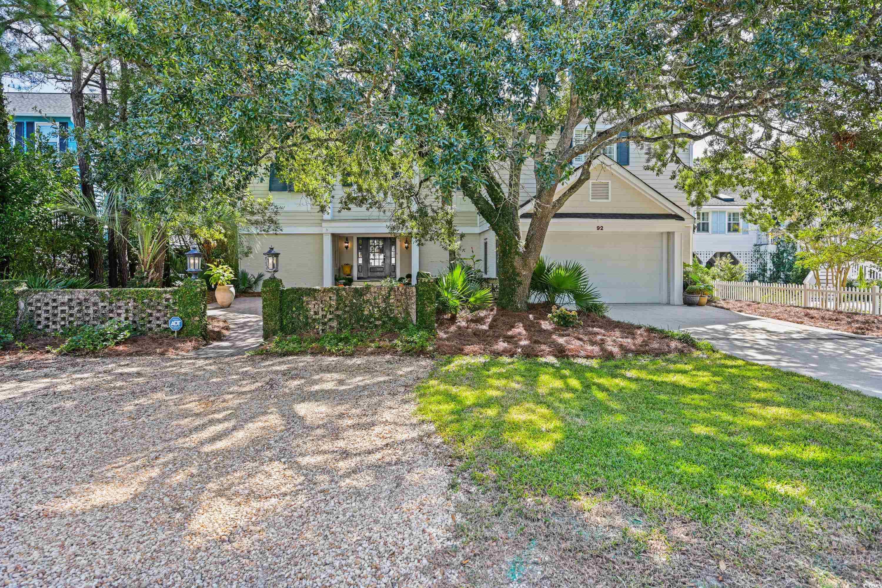 escape to your dream coastal haven in the heart of north litchfield beach! boasting 7 bedrooms (including two master suites, one on each level) and 6 bathrooms, this well-appointed home is perfect for those who cherish plenty of space in a beautiful beach-side community. enjoy an easy walk or golf cart ride to the beach then save time to relax in the private pool or unwind in the adjacent hot tub, all set amid a backdrop of lush tropical landscaping. entertain in style with a sprawling wraparound deck that comes equipped with a tabby, wood burning fireplace, ideal for those cooler evenings. for sun worshipers, the sun deck on the top floor not only provides an ideal lounging spot but also teases with a glimpse of the ocean's horizon. inside, discover a large living area with beautiful wood-finished ceilings, a gas fireplace, an open-concept kitchen and a big wet bar that make spending time with family and friends very comfortable. there are 4 bedrooms, extra living space and an additional gas fireplace on the bottom floor with a simple walk out to the pool courtyard and 3 bedrooms on the top floor, easily accessible with an elevator. whether looking for a beach getaway with potential rental income or a permanent home to make every day a vacation, 92 hanover is the perfect spot!