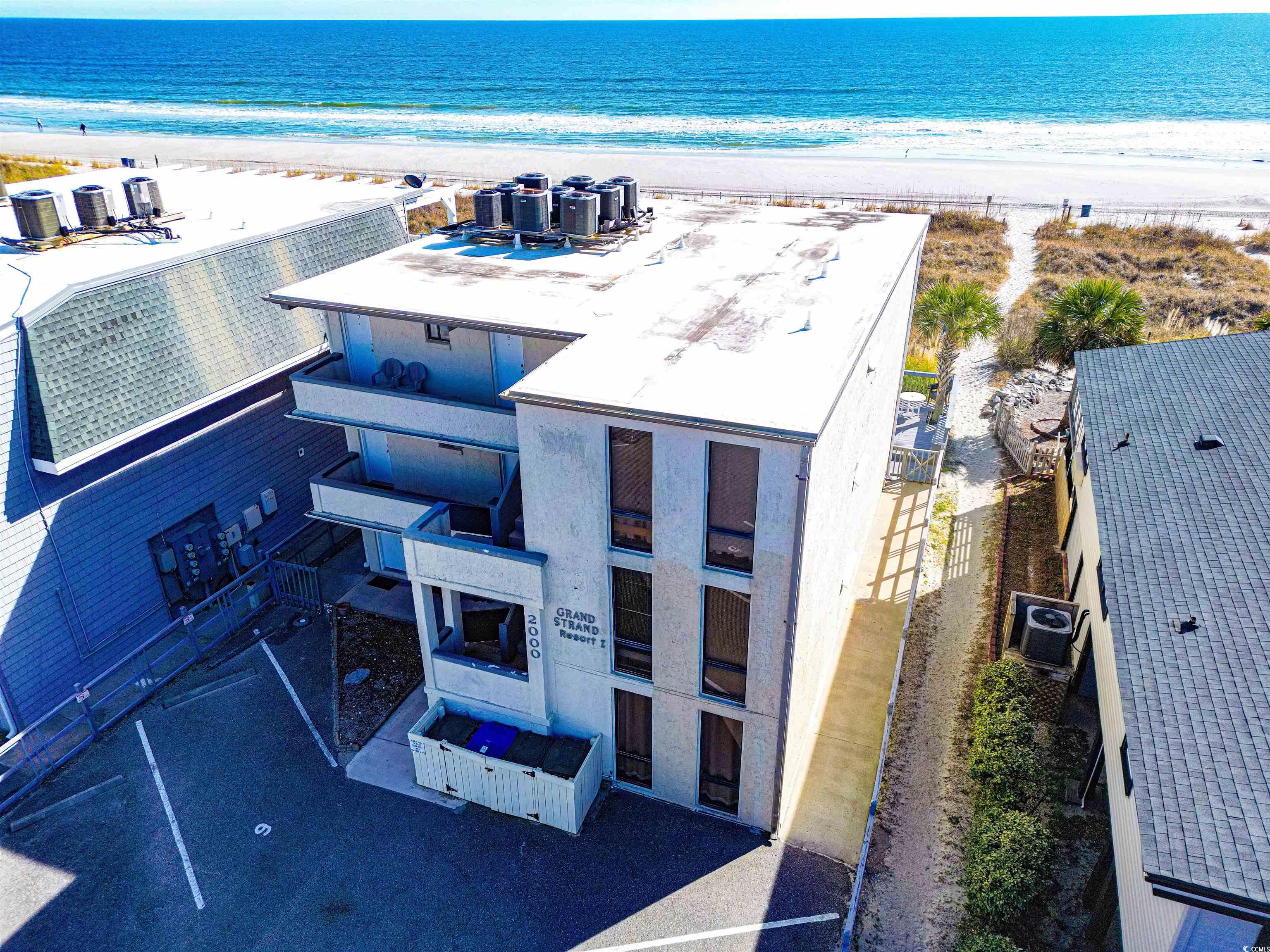 welcome to this oceanfront, turn key condo that offers the ultimate coastal living experience. it is located on the bottom floor of the complex. this unit has direct access to a huge deck which overlooks the ocean. there is a private path to the beach from the deck, which makes the beach only a few steps away! it is within blocks to shopping, restaurants, grocery, and fun activities. there are low hoa dues, and it has an excellent short term rental track record. whether you're looking for a vacation getaway or a year-round residence, this condo offers it all!