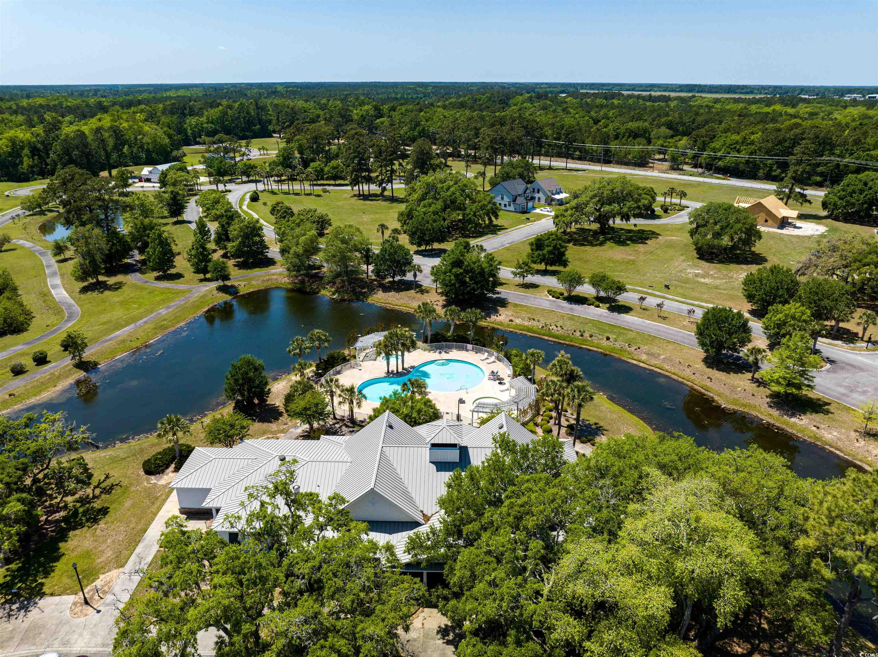beautiful pad ready, improved lot on a pond in south island plantation.  south island plantation is a gated community on winyah bay with amenities such as pool, club house, gym and day dock on the bay.