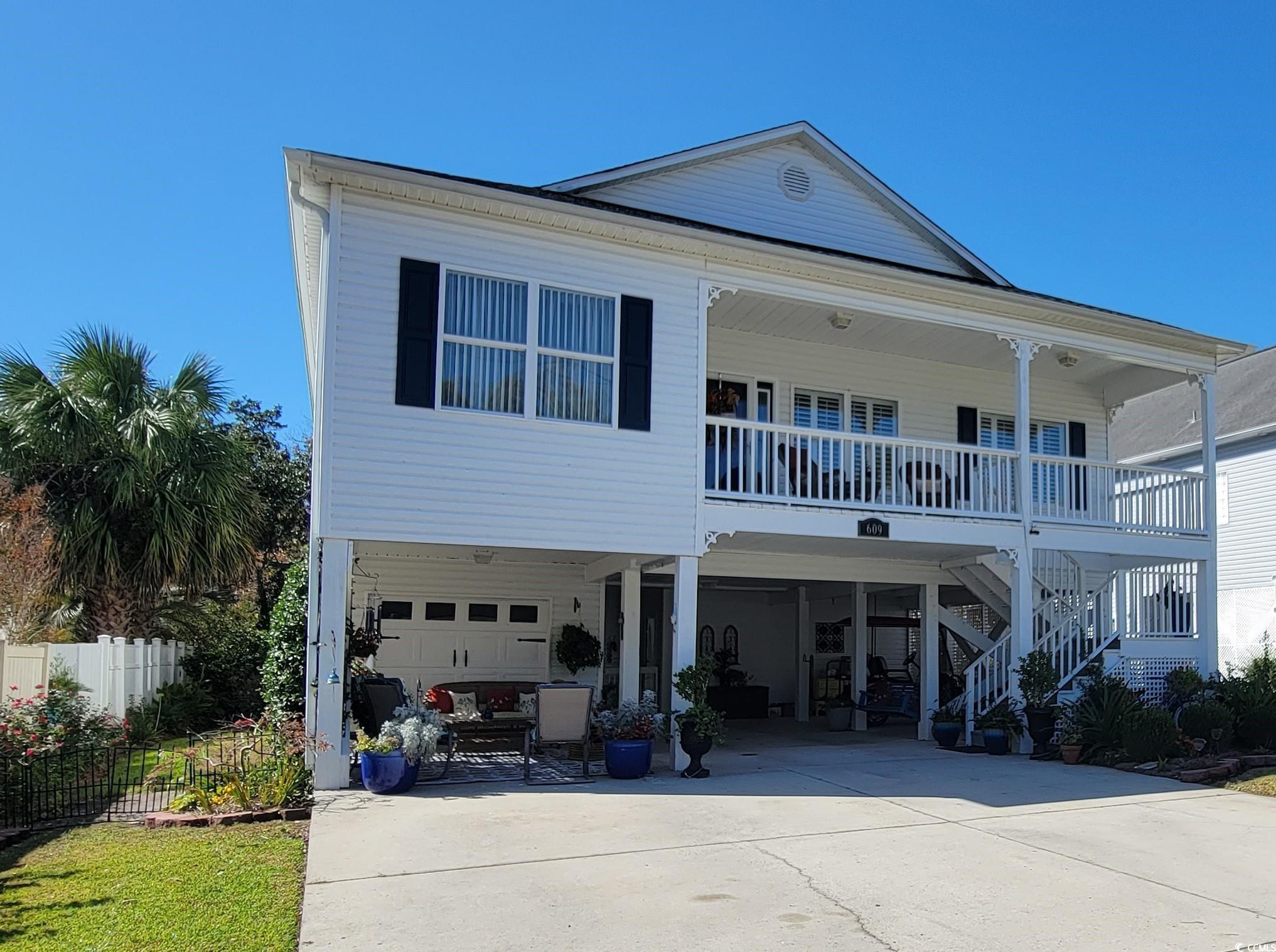 price improvement! no hoa fees and no flood zone - welcome to the highly desired area of cresent beach! this absolutely gorgeous 3-bedroom (only one wall would have to be put back for the 4th bedroom), 4-full bathroom home in crescent beach that is only a 5-minute walk to the ocean. this raised beach style home is on a closed end street that has less traffic flow which includes an enclosed 1 car garage with extra storage closet attached in the garage area. (the first floor ensuite bedroom could be a mother in-law suite) the blooming landscaped yard sits on a pond with tranquil sounds of fountains flowing. the backyard and both sides of the home are fenced in for pets and offers an outdoor shower. upstairs, you will find the main living areas that offer an open floor plan with beautiful wood flooring throughout. the open living area with a gas fireplace connects to the kitchen and formal dining. the fully equipped kitchen offers lots of cabinet & counter space. the master bedroom has double doors to the back deck, and easy access to the enclosed external elevator. the master bath has a glassed walk-in shower and garden tub with natural lighting of a window over the tub as well as double sink vanities. each bedroom features a ceiling fan, plenty of closet space, and easy access to a bathroom. the outside space offers a large back deck for relaxing and entertaining. recent upgrades include new shingles in 2023, a new hvac system in 2021 and the irrigation system pulls from the pond. this property is conveniently located to all that north myrtle beach has to offer- whether you want to shop, dine out, visit attractions, golf (47 courses within 10 miles), go bowling or visit the beach - this is the place for you! hurry and schedule your showing today appreciate the characteristics of what this home has to offer.