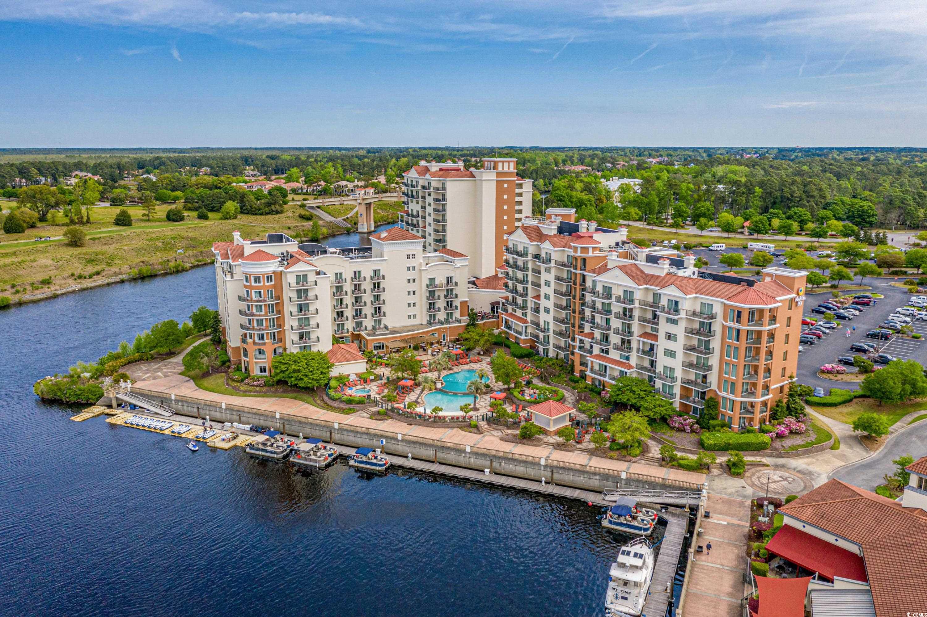 experience luxury living on the intracoastal waterway in this stunning 2-bedroom condo on the 9th floor. located in the beautiful marina inn at grande dunes, this unit offers a spectacular blend of convenience, comfort, and breathtaking views of the waterway and the grande dunes golf course.   this luxury condo grants you access to a range of superb amenities. take a refreshing dip in the sparkling indoor and outdoor swimming pools or hot tub, enjoy valet parking service, fitness center, waterscapes restaurant, reflections bar, in room dining, business center and more. the building is also conveniently located next to ruth’s chris steakhouse and the anchor café.   as an owner in the grande dunes, you have access to the private member’s only ocean club resort, which includes an oceanfront pool with food and beverage service, hot tub, beach access, bars, fine dining, meeting room, and member social activities and events.   unit 9405 offers a spacious layout that connects the kitchen, dining, and living areas. the main living area features a fireplace and large balcony. the primary suite offers a king bed, private balcony, and an en-suite bathroom. the guest bedroom encompasses two queen beds and leads into another full bathroom with in-unit washer and dryer. this unit comes fully furnished, just bring your suitcase!  the marina inn at grande dunes is conveniently located in myrtle beach near the beach, marina with boat docks, shopping, dining, entertainment and the grand strand medical center. great as primary residence, second home or investment property. schedule your tour today! square footages are approximate. all information is deemed reliable but should be verified by buyer.