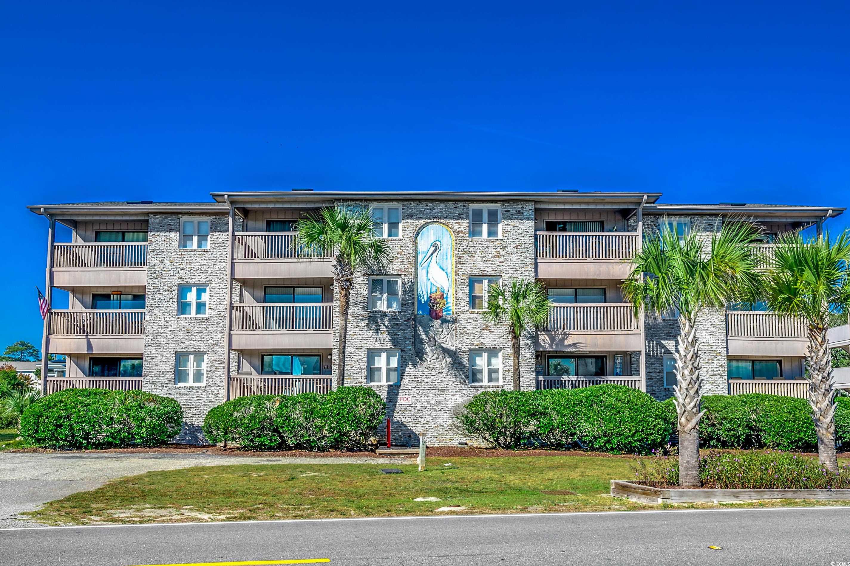 301a pelican pass, located in surfside beach, has expansive ocean views where the tranquil blue ocean meets the sky at the horizon. this fully furnished condo offers the comfort of a home close to the ocean. this 1092-square-foot condo features high cathedral ceilings with a skylight, laminate wood floors, and tile work on the corner-end top floor. it includes two bedrooms and two bathrooms, each room equipped with ceiling fans and a newer hvac system installed in 2022 for improved comfort. the interior boasts an all-white, well-appointed kitchen, a full-size washer and dryer, and a private balcony accessible from the living room and master bedroom, offering fantastic ocean views. within the well-maintained complex of pelican pass, residents have access to a large community pool and are situated approximately 480 feet from public beach access. strategically placed half a mile south of surfside pier and close to a vibrant restaurant district, the location is convenient for accessing local amenities such as libraries, parks, sports courts, grocery stores, and a seasonal farmer's market on foot. it's also within a comfortable distance to attractions such as barefoot landing, broadway at the beach, myrtle beach state park, the myrtle beach boardwalk, and skywheel, with the myrtle beach international airport only a 15-minute drive away. this property is ideal for those looking for a seasonal getaway, a profitable rental opportunity, or a permanent residence. marketed as a turn-key property, it promises a quintessential beachside experience. prospective buyers can take a matterport 3d virtual tour at www.bit.ly/301apelicanpass. 301a pelican pass encapsulates beach living with its stunning views and excellent location, offering an opportunity to own a piece of paradise.