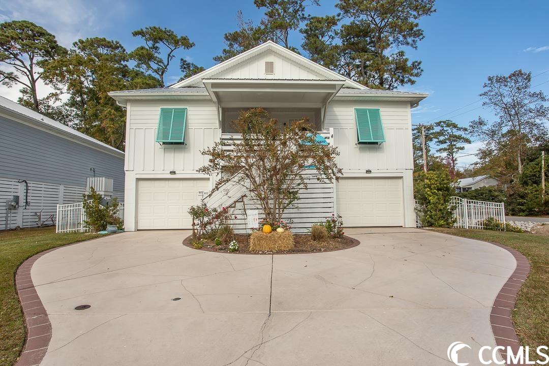 motivated sellers and new list price for this beautiful raised beach house in pawleys sunset just off the south causeway and a golf cart or bike ride over the bridge to the beach.  this 4 bedroom 4 and half bath home says pawleys island lifestyle.  the downstairs area has plenty of room for all your toys.  the screened in living area with easy breeze windows and gas fireplace gives you ample room to entertain after a day at the beach or a cozy fall evening to relax and enjoy some football. this area also includes a storage room for all your tools, there is a half bath and outdoor shower.  up the stairs is a covered front porch and as you enter the home you will be greeted by vaulted ceilings with ceiling fans, an open living area with luxury vinyl plank flooring, kitchen with white staggered cabinets, island, granite countertops and stainless steel appliances.  there are two bedrooms off the main living area on each side of the home with each having its own bath.  the master bedroom has two walk in closets.  the master bath has dual vanities, comfort height toilet, walk in shower and the washer and dryer hookups.  this house features a back deck off the kitchen, a downstairs back patio, tankless hot water heater, smart home panel, irrigation system, sentricon termite control.  the owner has added hurricane panels, overhead steel garage doors, leaf filters, white aluminum fencing and more.  don't miss out on your opportunity to be minutes from fishing, crabbing, kayaking, paddle boarding, the beach and all that pawleys island has to offer. all measurements and square footage are approximate and not guaranteed.  buyers are responsible for verifications.