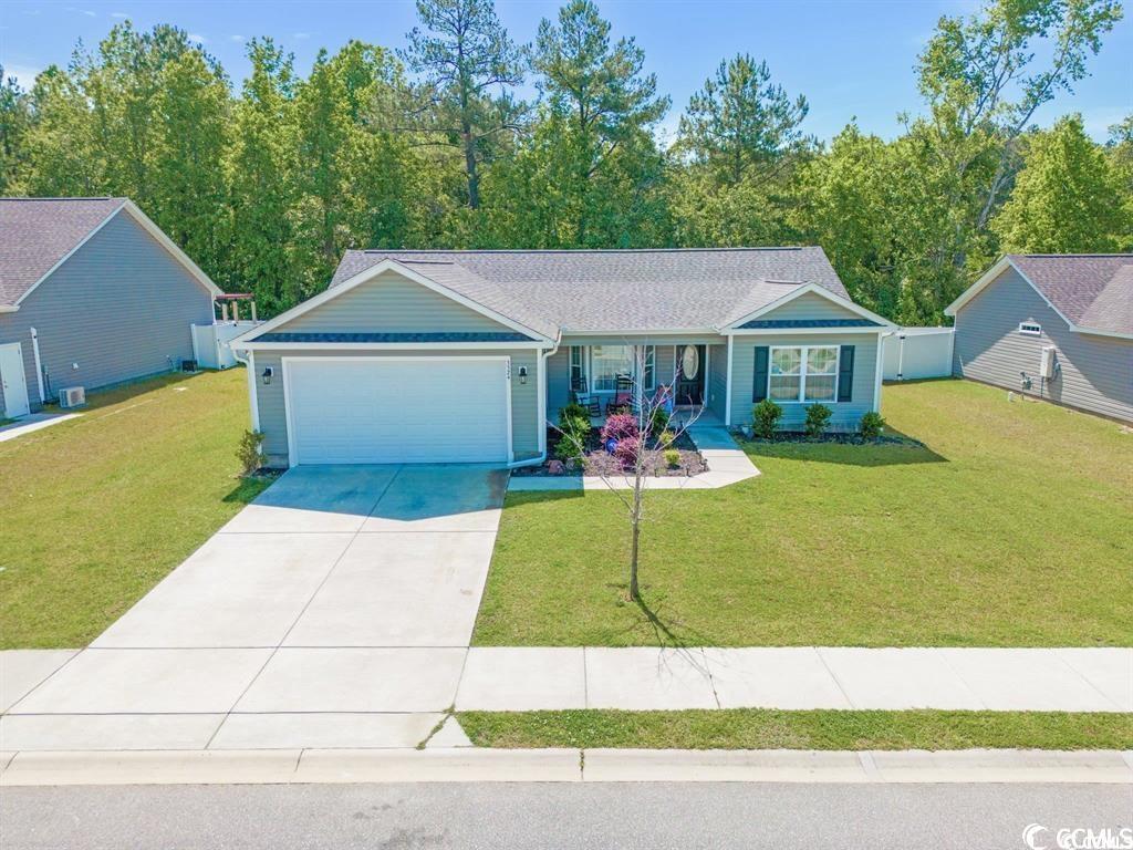 welcome to 3524 merganser dr. in the charming community of woodland lakes, conway, sc 29527. nestled conveniently between hwy. 701 s and hwy 378, and just a short drive from the county seat of historic conway, this 3-bedroom, 2-bathroom home built in 2019 awaits you.  as you step into this meticulously crafted residence, you are greeted by a spacious living area boasting vaulted ceilings, creating an open and airy ambiance. the thoughtfully designed split bedroom floorplan ensures privacy and functionality. the rear patio invites you to enjoy the serene outdoors, and the expansive backyard provides endless possibilities to craft your own backyard oasis for relaxation and entertainment.  the heart of this home lies in its well-appointed kitchen, featuring stainless steel appliances that convey with the sale. whether you're a culinary enthusiast or just love to gather with family and friends, this kitchen is ready to fulfill your needs.  the master bedroom is a retreat of its own, offering a tray ceiling, a generously sized walk-in closet, and an ensuite bathroom with a convenient step-in shower and linen closet. the attention to detail in the master suite ensures a comfortable and luxurious living experience.  practicality meets convenience with a separate laundry room that leads to the attached 2-car garage, providing both storage and shelter for your vehicles. the laundry room also boasts a large pantry, offering additional storage solutions.  this home comes complete with a washer and dryer, which convey with the sale, making the transition into your new home seamless. don't miss the opportunity to make 3524 merganser dr. your own – a modern residence with a perfect blend of style, functionality, and the promise of creating lasting memories. welcome home to woodland lakes.