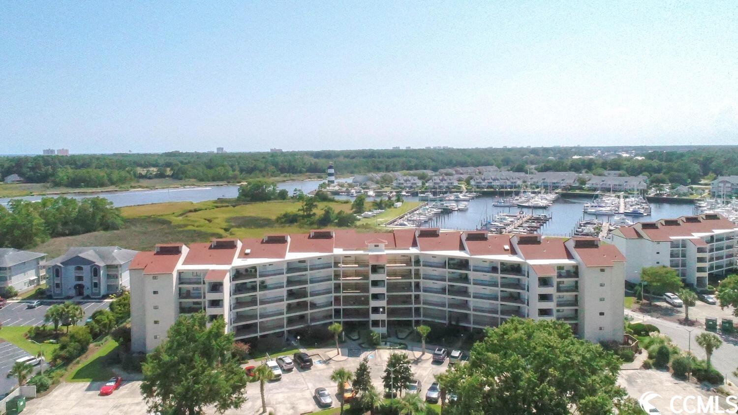 welcome home to this beautify 2 bedroom 2 bath condo that greets you with stunning harbor views and intracoastal views including the iconic little river lighthouse at the entry to this condo.  all the furniture conveys, but none of the artwork or personal items on the furniture.  when you open the door the view will wow you! and you will see that the open concept floor plan is very spacious allowing for plenty of seating and entertaining.   the kitchen has solid surface counter tops, updated cabinets and the counter space is abundant. the dining area is open concept with space for a large dining table.   behind the kitchen is a laundry/pantry area, which is also spacious.  moving on you will find two bedrooms and two baths.  both bathrooms have been updated and the main bathroom in the owners suite has an exquisitely designed walk in shower and a one of a kind vanity.  the guest room has a handcrafted murphy bed that houses a large bed and serves dual purpose as a great place for your prize possessions to be displayed, and gently moved to the side when the bed needs to be utilized.  the main bedroom has both views of the spacious outdoor living balcony and views of the harbor.  there is an owner storage multi-use room within the condo.  this unit has an associated dock which is k-5 and it is is a 42ft. slip.   seller is a sc and nc realtor located outside of the grand strand area.