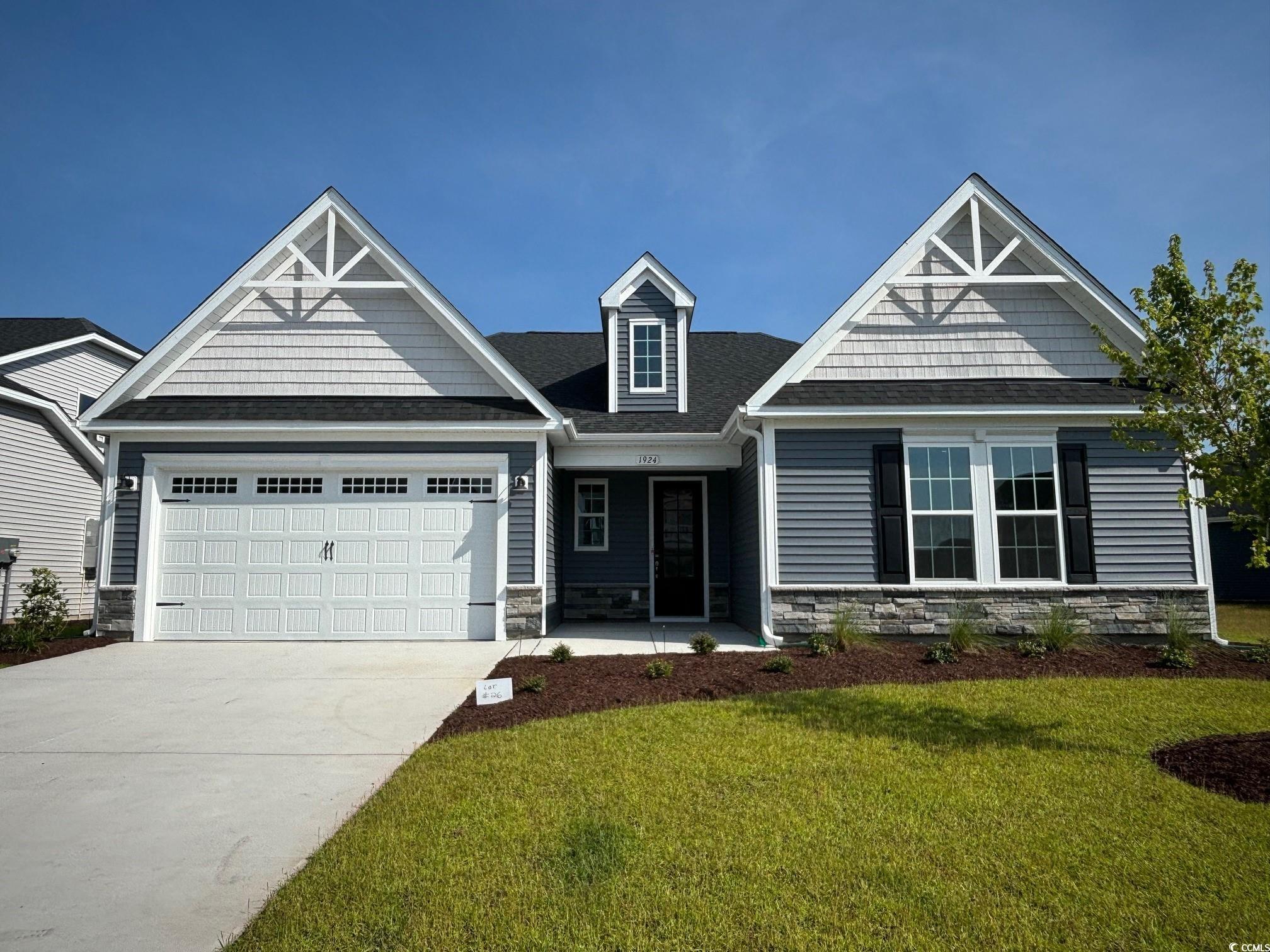 the seashore floor plan is located in seaglass village of bridgewater!  the spacious, ranch style home with full bonus room features coastal inspired architectural accents, outdoor living area and an extended garage. a covered front porch welcomes you home to a large, inviting foyer.  multi generational suite with full bathroom. bedroom and kitchenette -great use of space for anyone to use. upstairs you will find a guest bedroom, full bath, huge loft area and tons of storage. the kitchen on main level  has shaker style cabinets, large center island with sink & ge stainless appliance package.  bridgewater is a natural gas community!  this seashore has a gas furnace and gas tankless water heater.  the master bedroom has a trey ceiling with crown molding and 2 large walk in closets.  dedicated laundry room is very spacious.  master bathroom features an oversized fully tiled walk in shower-no door, dual vanity, water closet with comfort height commode and large linen closet for storage.  enjoy the carolina sea breeze out on the covered rear porch.  this home is a must see on an oversized lot in bridgewater!  schedule your appointment today. ***photos are from another home***