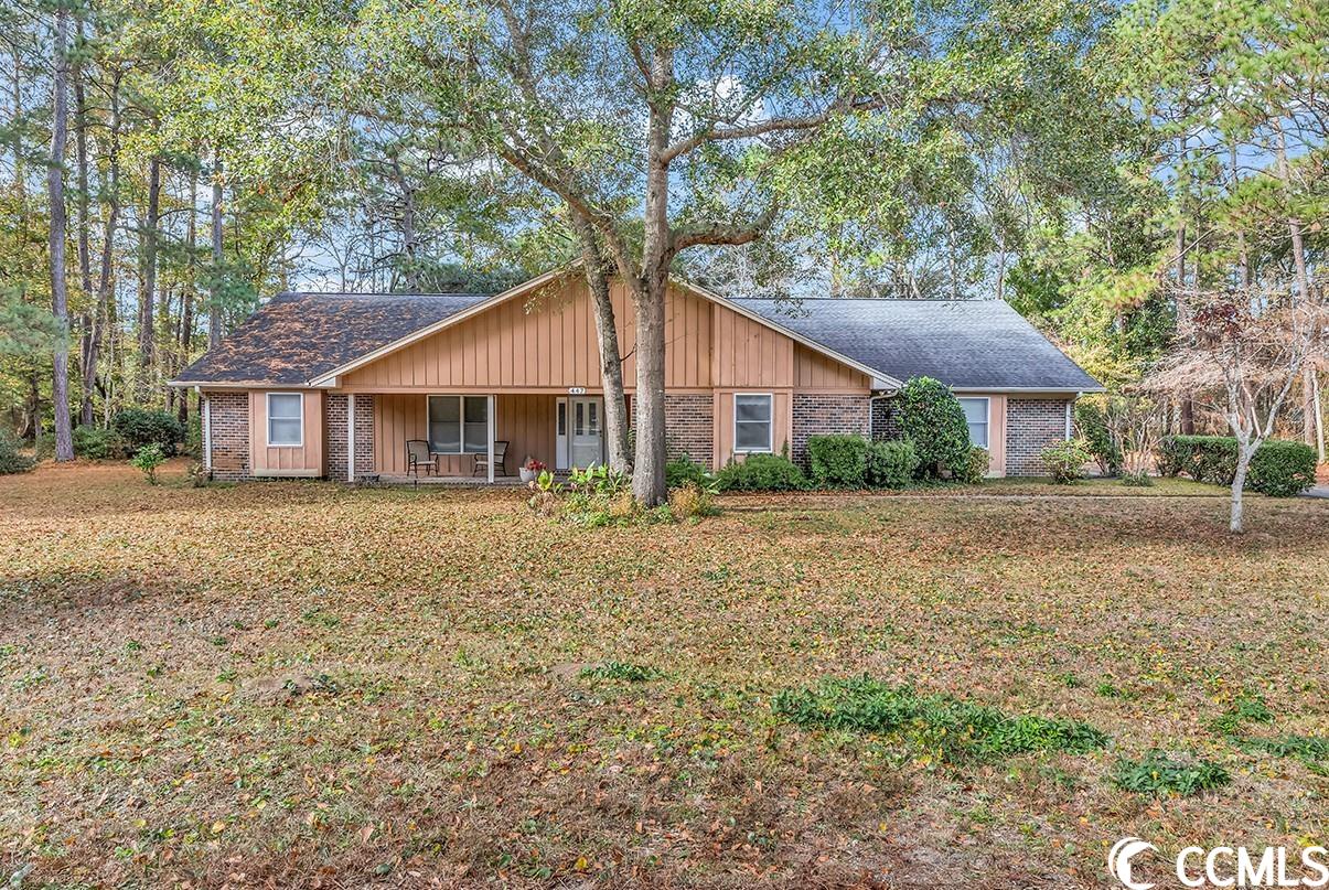here is your chance to be in the desirable pawleys island neighborhood of hagley estates! this single level, brick exterior 3 bedroom, 2 bathroom home has an abundance of space, inside and out. a sizable kitchen with new granite countertops (2020) and lvp flooring (dec 2023), formal dining room, living room, carolina room and screened porch with extensive views of your secluded backyard. loads of cabinets and storage space in the kitchen and the oversized 3 car garage. (880 square feet of garage space!) the 3rd bay is temperature controlled--use it as a workshop, hobby area, golf cart parking and more. this well-built and maintained custom designed home sits on a unique .79 acre lot (originally 2 lots merged together) offers plenty of privacy with its picturesque trees and mature landscaping with the founders club golf course and a pond as your neighbors behind. this a must see home in scenic pawleys island! (all figures are approximate and not guaranteed. buyer responsible for verification.)