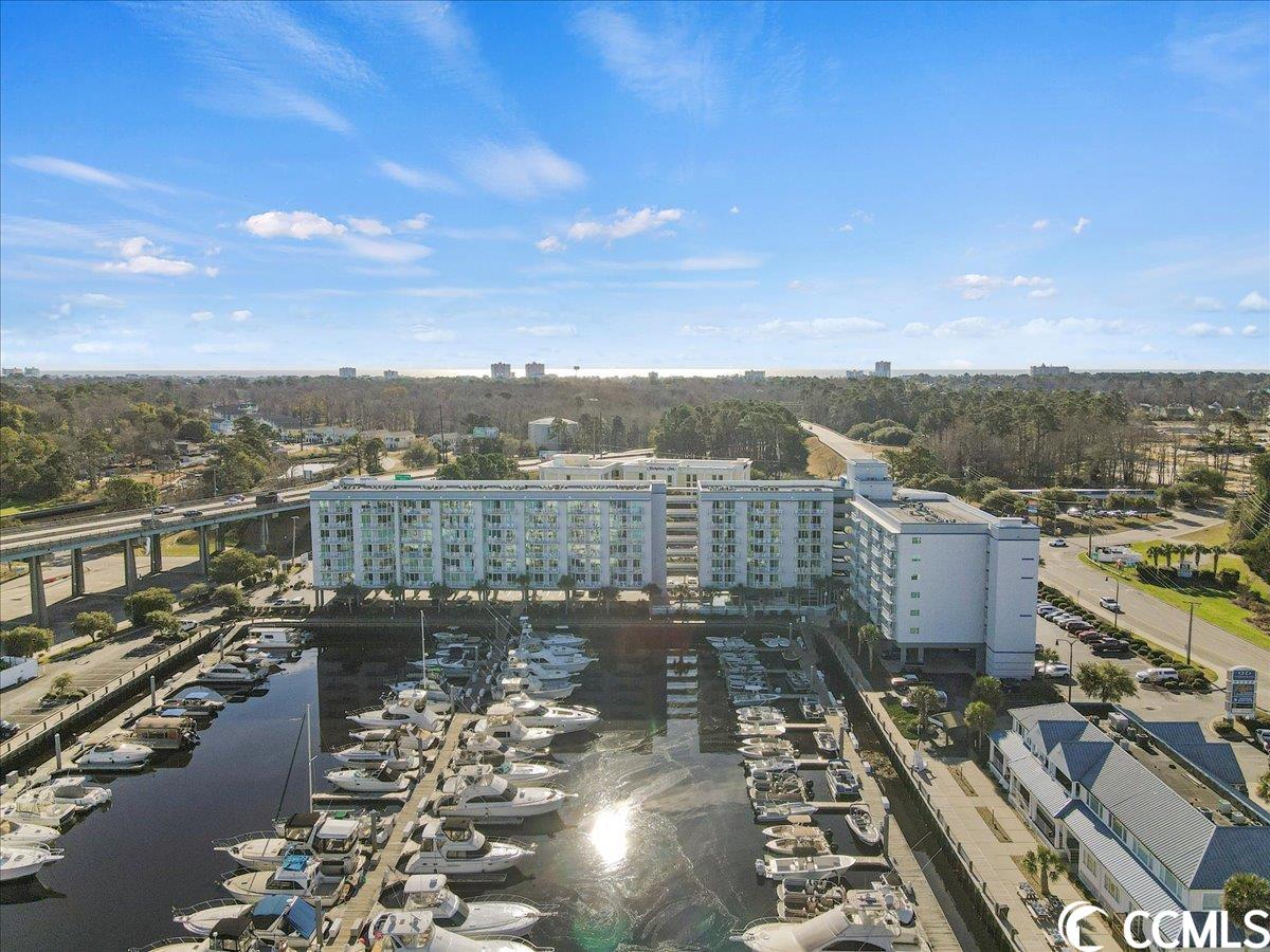 discover the charm of this 4th-floor condo at harbourgate marina and resort. this 1 bedroom and 1 bath, features an open floor plan that seamlessly integrates the kitchen, dining, and living areas, offering breathtaking views of the marina.  convenience is at your fingertips with a stack washer and dryer in the unit. the real highlight is the master bedroom overlooking the intracoastal waterway and harbourgate marina. the building is meticulously maintained, and this particular unit, having never been rented, is in excellent condition. recent upgrades include new carpet in the bedrooms and beautiful wood floors in the living room.  whether you're seeking a second home for vacations, a potential rental investment, or a primary residence, this condo fits the bill. the building provides a secure environment with a range of amenities, making it an ideal place to call home. take advantage of the resort's features, including a pool and a welcoming lobby and lounge that offer panoramic views of the marina. conveniently located within walking distance restaurants and night life.  you owe it to yourself to check this one out today! give us a call to see!!