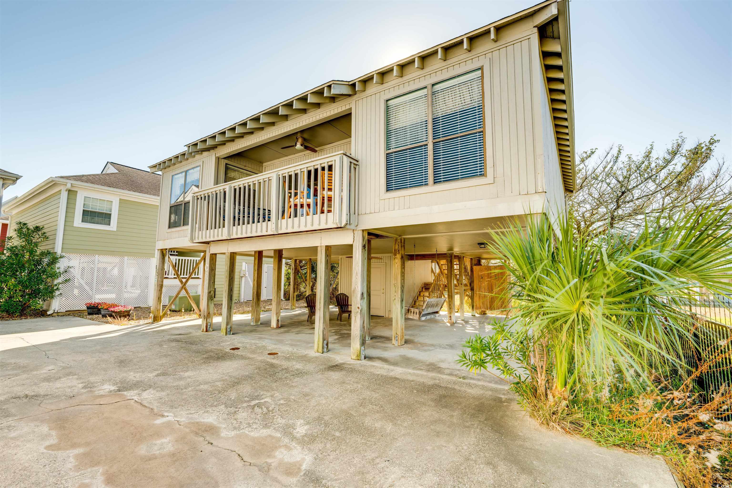 this charming beach getaway features three bedrooms, two baths, full kitchen, breakfast bar and balcony. located one block from the beach with convenient public access across ocean boulevard. cypress place is an 8-home cottage community that includes a community pool. the home includes an attached storage room downstairs and covered parking underneath. the hoa includes water/sewer, pool service, cable & internet, and landscaping. the property is sold furnished and turn-key ready. this location is everything you need to enjoy the beach and the surrounding dining activities. all measurements and square footage are approximate and not guaranteed. buyers should verify.  full size washer/dryer located in storage area on ground level. this unique opportunity puts you a block off the beach in prime garden city beach location; very short walk to beach; well maintained! must see!