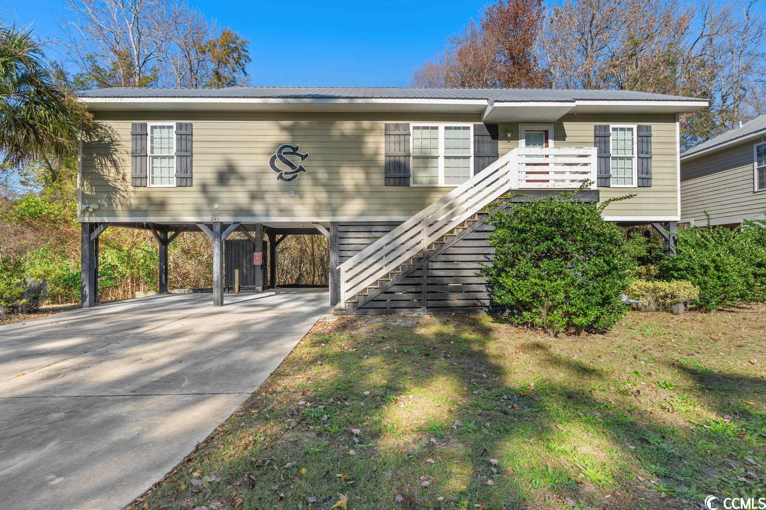 discover your pawleys island haven! east of hwy 17 with no hoa, this unique two-bedroom, two-bathroom raised beach house offers the ultimate coastal lifestyle! just minutes away from the beach by golf cart, this home boasts parking, an outdoor shower, and a screened area for relaxing summer evenings or entertaining guests! inside, an open layout seamlessly connects the living room and kitchen, perfect for gatherings. with bedrooms on each side, each with its own full bath, this property is an ideal family retreat or investment opportunity! embrace the pawleys island charm and claim your spot in this coastal gem!