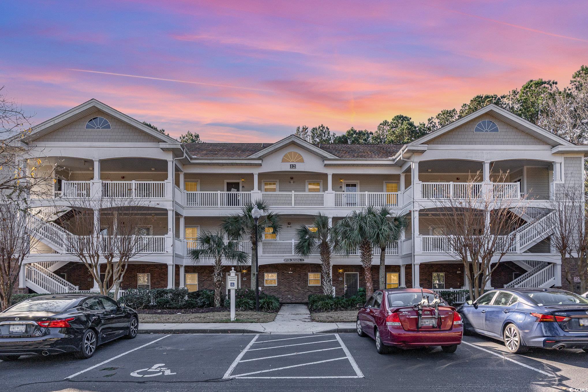 welcome to this extremely well kept, top floor, fully furnished, end unit with amazing golf course views.  located at river crossing in the award-winning barefoot resort and golf community, this is a rare find as there is no building next door which gives an additional amount of privacy.  the cathedral ceilings and open floor plan give this condo a bright and airy feel.   recently added features include new water heater, new paint in the living area, ceiling fans, 3 flat screen tvs, tv stand, 2 twin beds and mattresses in guest bedroom, patio furniture, new blinds, and more…… sit on your back porch for a morning coffee or evening dinner and enjoy the views.   the community pool can be seen from the front walkway and barefoot resort has all the amenities for fun in the sun.  there is another large pool located on the waterway at the towers, and a private beach cabana is accessible to owners.  there is even a beach shuttle that has a seasonal schedule.  four world class golf courses, driving range, marina, and restaurants are all only a short distance.