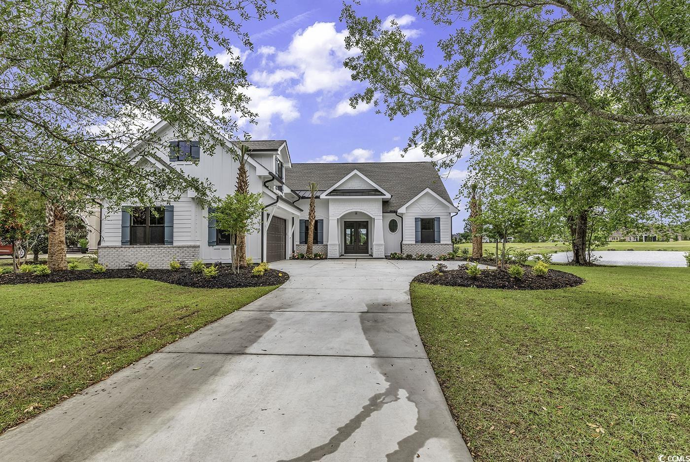 welcome to your "dream home" here at the beach.  ideally located just off hwy 501 in between myrtle beach and conway in the prestigious golf neighborhood of wild wing.  you will love the quintessential expansive view of the pond and golf course in your backyard. renowned nations homes is the builder of this well-designed custom plan.  walk in the door and immediately feel at home with the great room concept.  features include a large owners suite with spacious walk-in closets that are finished with custom melamine shelving.  plus a well designed en suite with double vanities, walk-in shower and private bathroom.  the large great room has a vaulted ceiling with beams, fireplace, floating cabinets and bookshelves. enjoy cooking in your designer kitchen with stainless steel appliances, solid cabinets with soft close doors and high-quality quartz countertops.  bedrooms 2 and 3 each have an attached full bath.  bedroom 4/guest suite is located for privacy and perfect for your guests.  lush landscaping is ideally located to provide the best presentation as you arrive.   you deserve this custom home and the accompanying lifestyle.