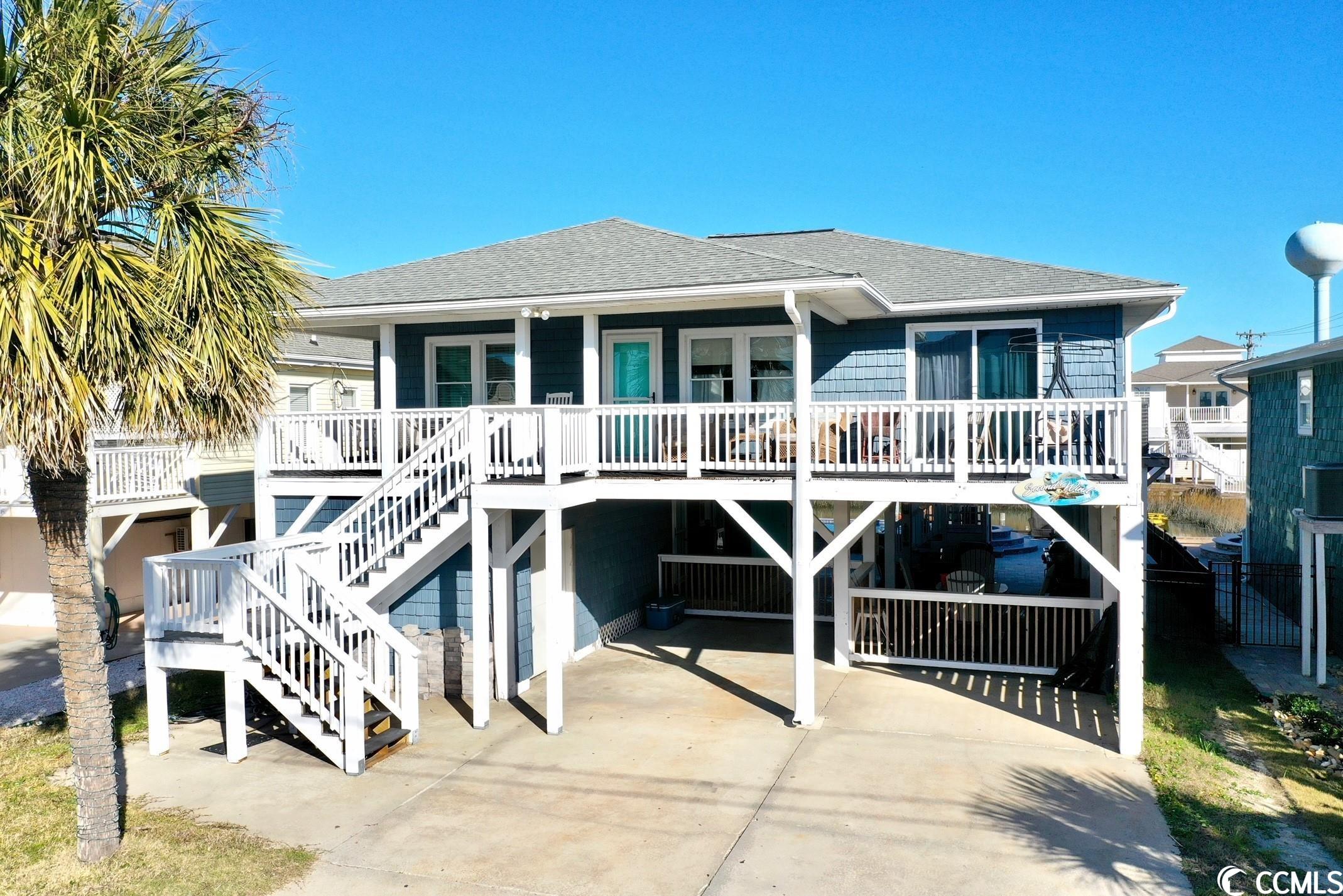 back on market! no fault to seller! beautifully updated and furnished beach home, just 1 block from the beach! this home is located in the channels of cherry grove, which is a section of north myrtle beach, sc. the layout of this home is 3 bedrooms and 2 full bathrooms upstairs, 2 bedrooms, 1 full bathroom, and a half bathroom downstairs. the 2 downstairs bedrooms are similar to "lock out units" each equipped with their own private entry and bathrooms. brand new saltwater pool, that can be heated or cooled. along with a fenced in yard and a floating dock! there is laundry and an outdoor shower downstairs for your convenience! plenty of room for entertainment! this raised beach home is ideal for several purposes such as, rental property, family vacation home, or a wonderful primary residence where you could enjoy the beach life! buyer is responsible for all measurement verifications.