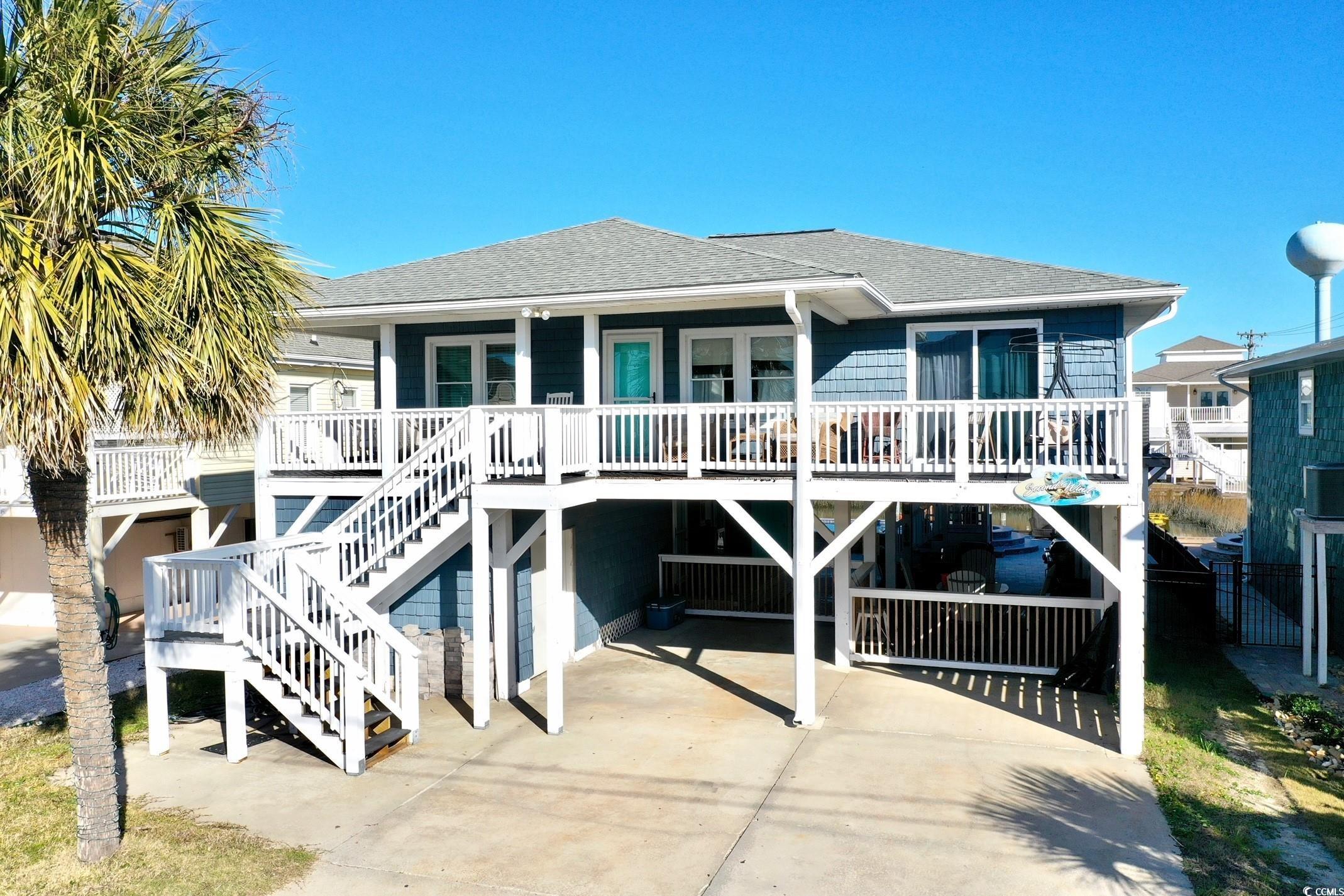 back on market! no fault to seller! beautifully updated and furnished beach home, just 1 block from the beach! this home is located in the channels of cherry grove, which is a section of north myrtle beach, sc. the layout of this home is 3 bedrooms and 2 full bathrooms upstairs, 2 bedrooms, 1 full bathroom, and a half bathroom downstairs. the 2 downstairs bedrooms are similar to "lock out units" each equipped with their own private entry and bathrooms. brand new saltwater pool, that can be heated or cooled. along with a fenced in yard and a floating dock! there is laundry and an outdoor shower downstairs for your convenience! plenty of room for entertainment! this raised beach home is ideal for several purposes such as, rental property, family vacation home, or a wonderful primary residence where you could enjoy the beach life! buyer is responsible for all measurement verifications.