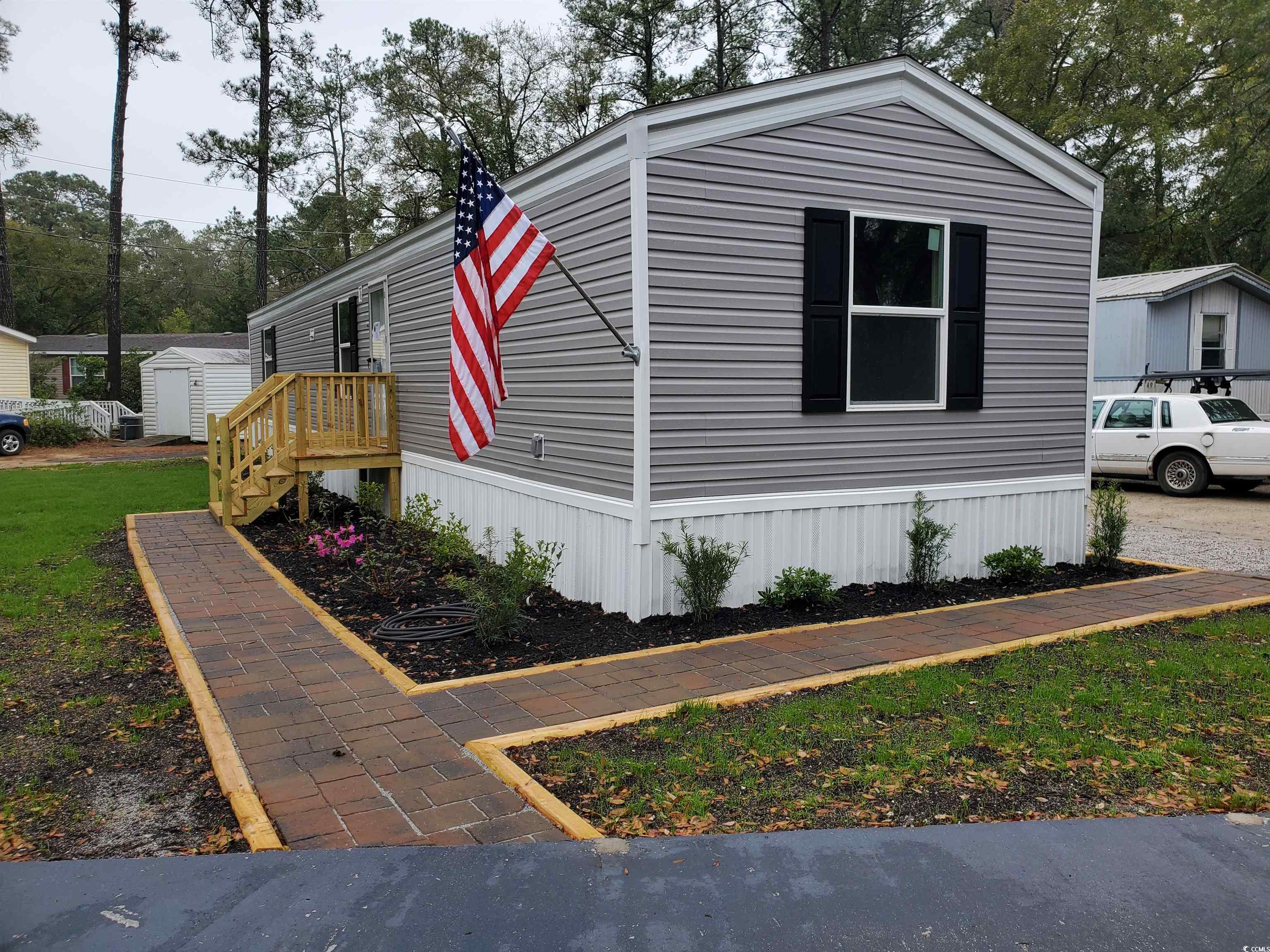 brand new home located on a corner lot.  home has new landscaping, walkway pavers, cement parking pad and a gravel driveway. this 14x66 clayton home elation model is an energy smart home for comfort and savings.