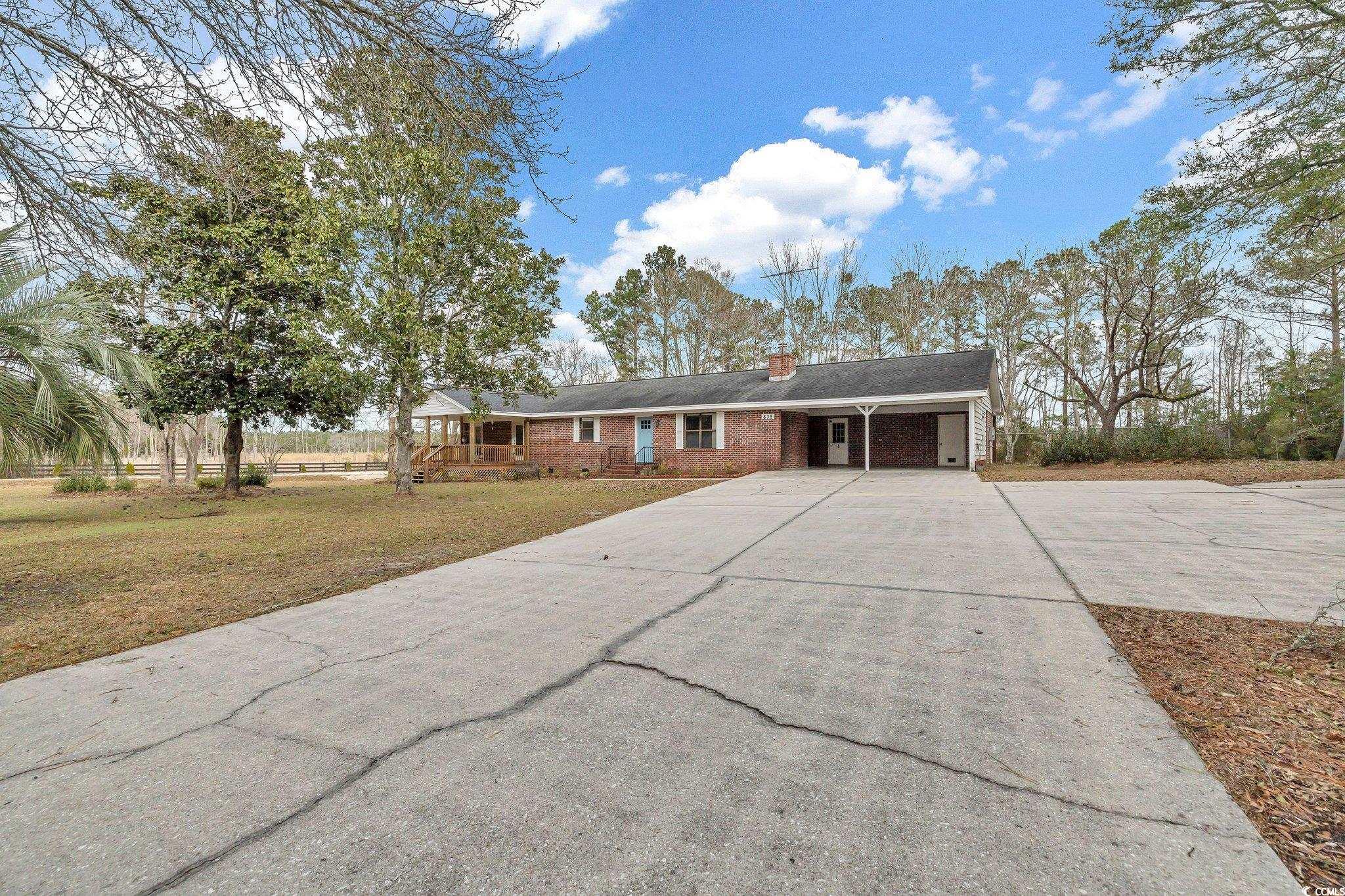 welcome to 838 sunfish st., a serene retreat in georgetown, sc, where privacy meets convenience. situated on a sprawling 1-acre lot, this home offers a remote and private feel while still being conveniently close to town. this charming ranch-style home features 3 bedrooms and 2 baths, providing a comfortable and spacious living environment. as you approach, you'll be greeted by the tranquility of the surrounding nature, creating a peaceful oasis to call home.  the convenience of a carport adds to the practicality of this residence, ensuring your vehicles are sheltered. inside, a cozy fireplace becomes the heart of the home, creating a warm and inviting atmosphere during cooler evenings. embrace the outdoors from the large covered front porch or large fenced where you can unwind and enjoy the beauty of your private surroundings.  discover the perfect blend of seclusion and proximity at 838 sunfish st. your dream home awaits – schedule a visit to experience the tranquility and charm of this georgetown gem.