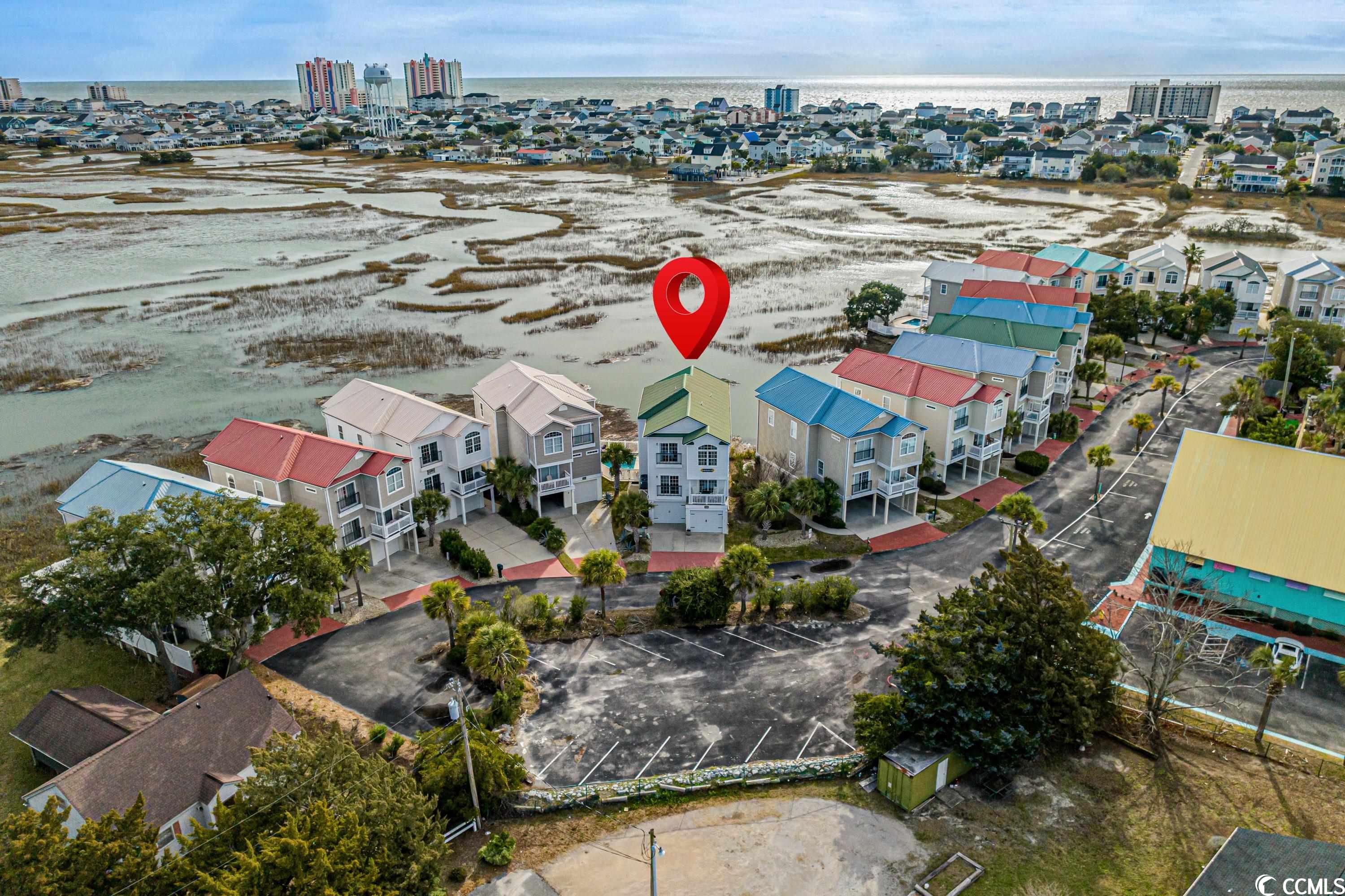 this 5 bedroom/4 bath gorgeous marsh beauty is the one! expansive marsh views located in the heart of cherry grove beach. from the 2 spacious marsh porches, you can see all the way to sunset beach, nc.  this home is the sweetest spot in the pointe marsh neighborhood. only owned by 2 different owners since its build and worth noting that this gem stays high and dry!  2502 pointe marsh lane has a special elevation on this lot that prevents all the flooding.  not to mention the past two owners have cared for this gem like a baby. updates include…auto garage doors with outside keypads, new large outdoor shower with bench, new outdoor trex decking, the only house in the neighborhood with outdoor wooden privacy shutters and the only one with an outside staircase taking you from the living area to the pool. convenience! new stainless steel 60 gallon water tank, new glass storm door, updated interior and exterior lighting. and if that is not enough….you also have an outdoor pool, elevator and 2 large locked storage areas under the house for your personal items. this home has unusually large bedroom closets that make storing things seamless. 2502 pointe marsh lane easily accommodates 5 vehicles. the hoa allows your boat or motorcycle to be stored in the garage as a privilege to owners only. the house is a short distance to the beach and only 50 feet away from the fun mini golf and ice cream shop. vacation rentals are allowed. the current owners hate to say goodbye to this truly loved marsh front vacation home. but new things are on their horizon.