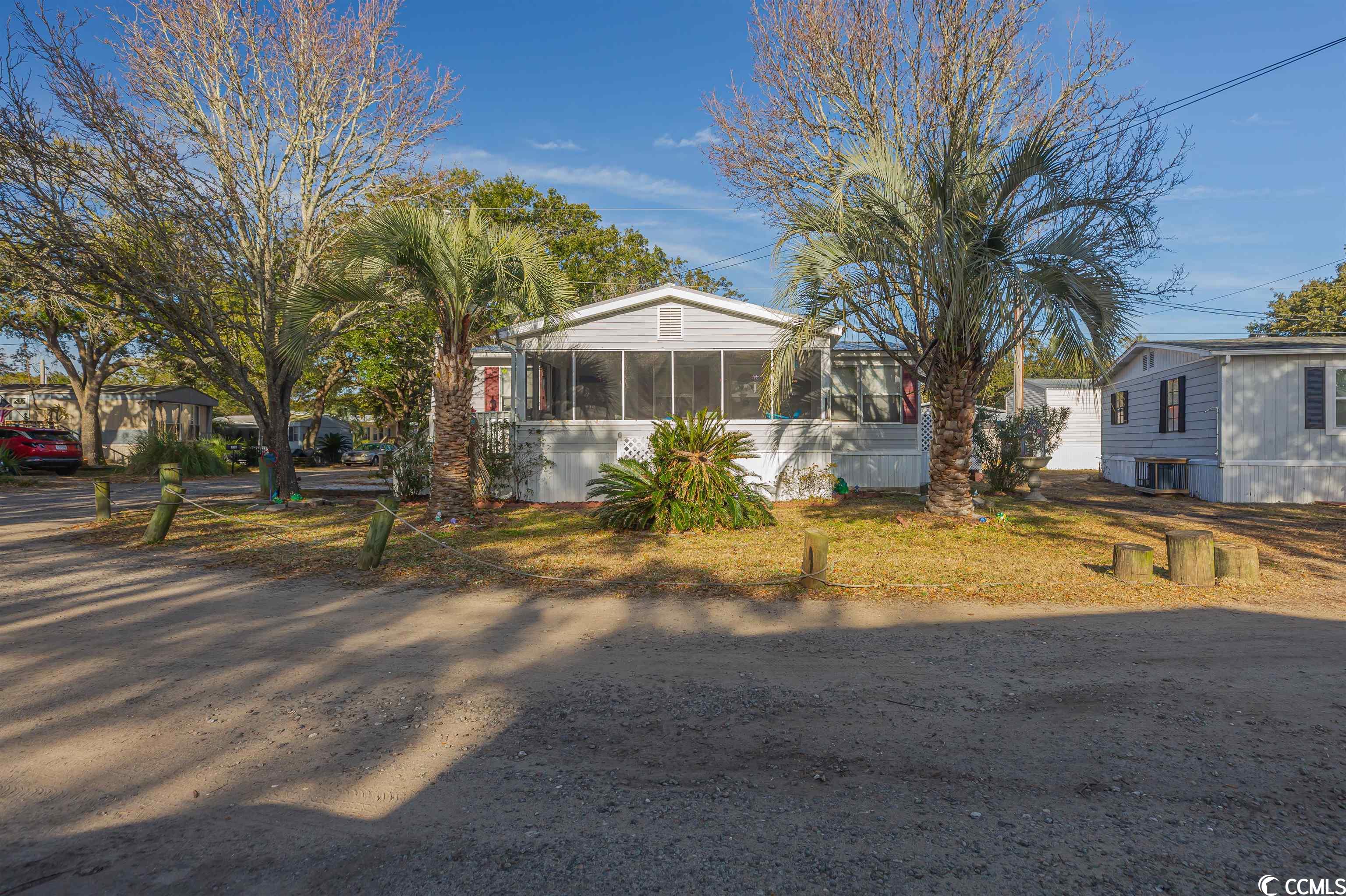 welcome home to this spacious beach house. the home had a new metal roof installed in 2022. hvac under 5 years old. washer and dryer convey. the large screened in front porch has a relaxing vibe and has a view of the marsh! golf cart will convey to enjoy a short ride to the beach. battery is under 2 years old.