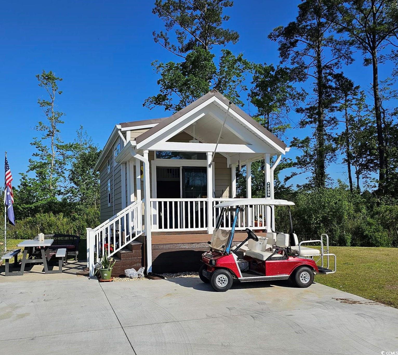 rare opportunity to own a home in sun outdoors myrtle beach!  (formerly carolina pines rv park)   live in a resort with amazing amenities which include a water park, lazy river, adult only pool, yoga studio, bowling alley, multiple swimming pools- including one enclosed pool, mini golf, fitness center, pickleball courts, arcade, playground, general store, dining and drinks bar, dog park, activities all year round, live bands every saturday during the summer and so much more! this 2019 1 bed 1 bath with 2 lofts can stay in the park or be moved to your own lot outside the park. house was freshly painted in 2022! this unique home has a new 2023 refrigerator, washer & dryer.  stove is run off propane. hvac is 2019 with a 7 year warranty.  sellers added an attached shed for more storage!   spacious living area to entertain or  outside on your front porch overlooking the lake view!   feel like you are on vacation every day!  surround yourself around the firepit and roast marshmallows!  grill outdoors and drink your favorite beverages!   take a ride on your golf cart, that comes with the home, and enjoy this amazing campground!   do not miss out on this rare opportunity!  partially furnished!