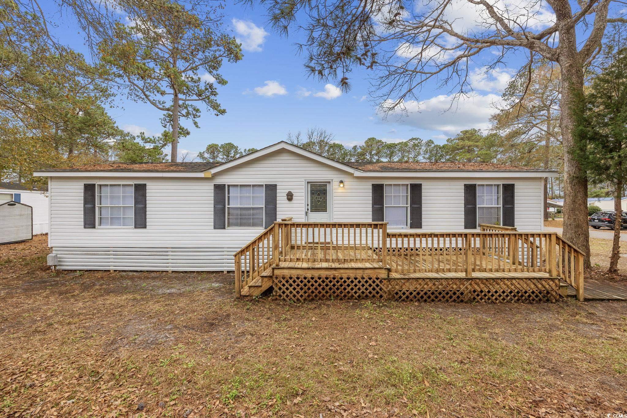 price improvement!!! experience coastal living in this delightful 3-bedroom, 2-bathroom double-wide manufactured home within the peaceful windjammer village. this property is the perfect blank slate and ready for new owners. the interior has been refreshed and features a spacious living area, an inviting kitchen, and a large outdoor deck perfect for grilling and entertaining. enjoy the community's amenities, including a pool and clubhouse. this home is centrally located just moments away from some of the areas biggest draws. hop on your golf cart and enjoy the sun-drenched beaches and fishing off the garden city pier. or explore the lively bars and restaurants along murrells inlet marshwalk, or reconnect with nature at nearby brookgreen gardens and huntington state park. whether you're searching for a permanent residence or a vacation retreat, this property encapsulates the essence of coastal charm. book your tour today!