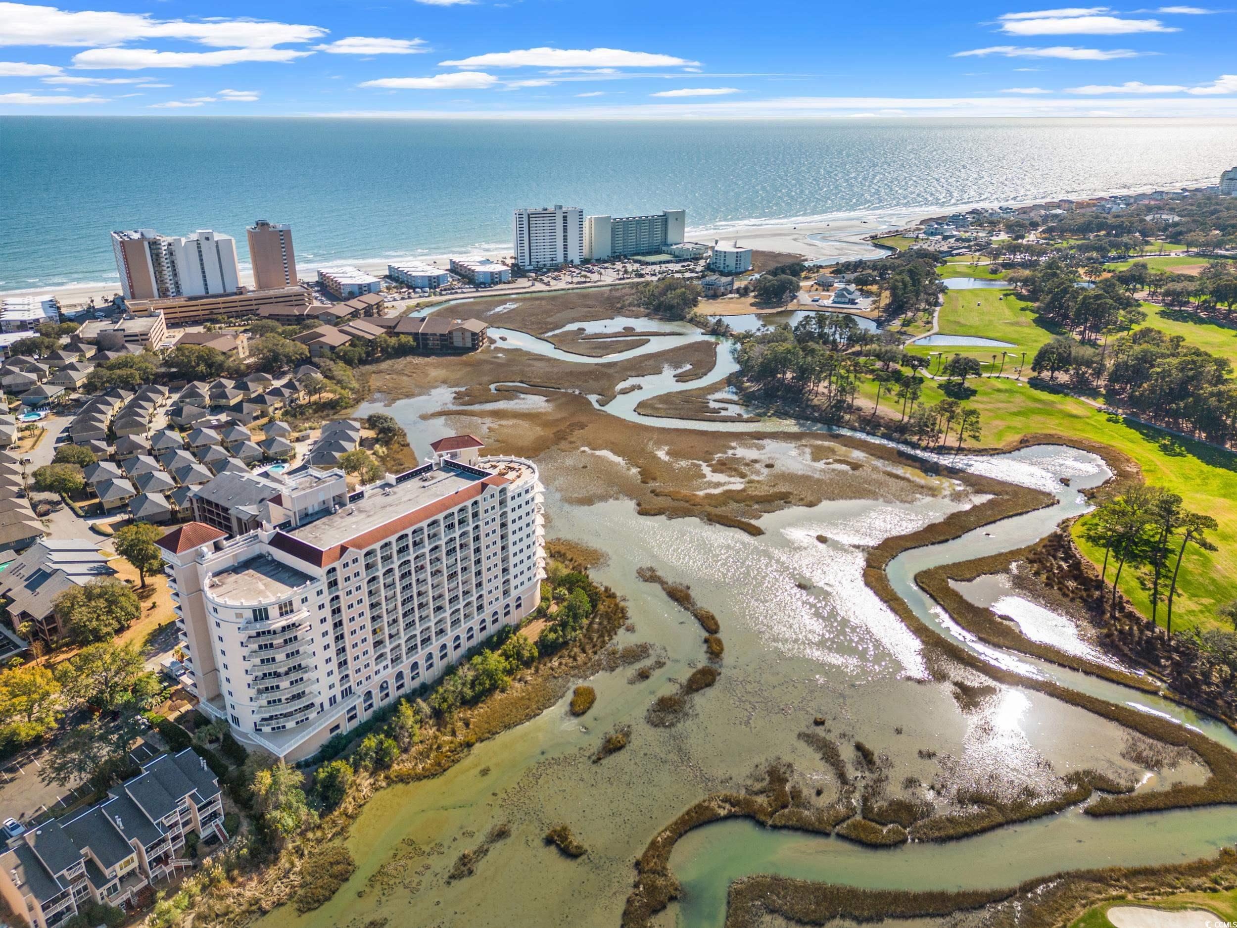 open house sunday from 2-4pm!! experience unparalleled luxury at the pointe in this meticulously maintained 3-bedroom, 3 1/2-bath condo overlooking the serene marsh and the dunes golf & beach club. revel in the opulence of this beautiful space featuring real hardwood flooring, freshly painted throughout.  there is no shortage of living space with an oversized living room that includes a wet bar and fireplace. indulge in culinary excellence in this stunning kitchen adorned with sleek granite countertops and equipped with top-of-the-line viking appliances. escape to lavish retreats within these luxurious bedrooms, two of the bedrooms boast a private balcony that opens up to breathtaking views of the tranquil marsh. these serene spaces are complemented by their own en-suite bathrooms, offering an indulgent oasis of comfort and privacy. the third bedroom features a custom built-in, perfect for a home office. enjoy exclusive amenities including the roof top deck with views of the atlantic ocean, indoor pool & spa, fitness center, an owners lounge, enjoy the convenience of golf cart parking, the pointe truly offers a lifestyle of elegance and sophistication. the hoa fees include all utilities including the gas for the fireplace and viking gas stove, minus the electric in the condo. welcome to your refined retreat where every detail has been thoughtfully curated for the utmost comfort and style. schedule your private tour today!